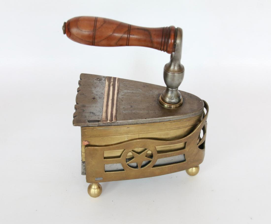 EARLY SLUG IRON: EARLY IRON WITH BRASS OVERLAY - ROUND NOSE - COMPANION BRASS TRIVET THAT HAS BALL FEET AND CUT WORK STAR DESIGN. 6"