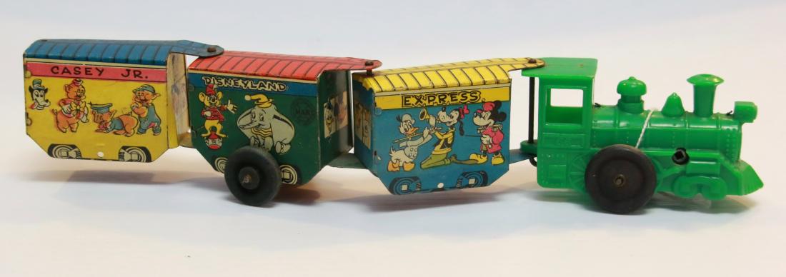 DISNEYLAND EXPRESS TRAIN: CASEY JR. - BY; WALT DISNEY PRODUCTIONS - MFG. BY; MARX - TIN LITHO WITH A PLASTIC ENGINE Size:13" L