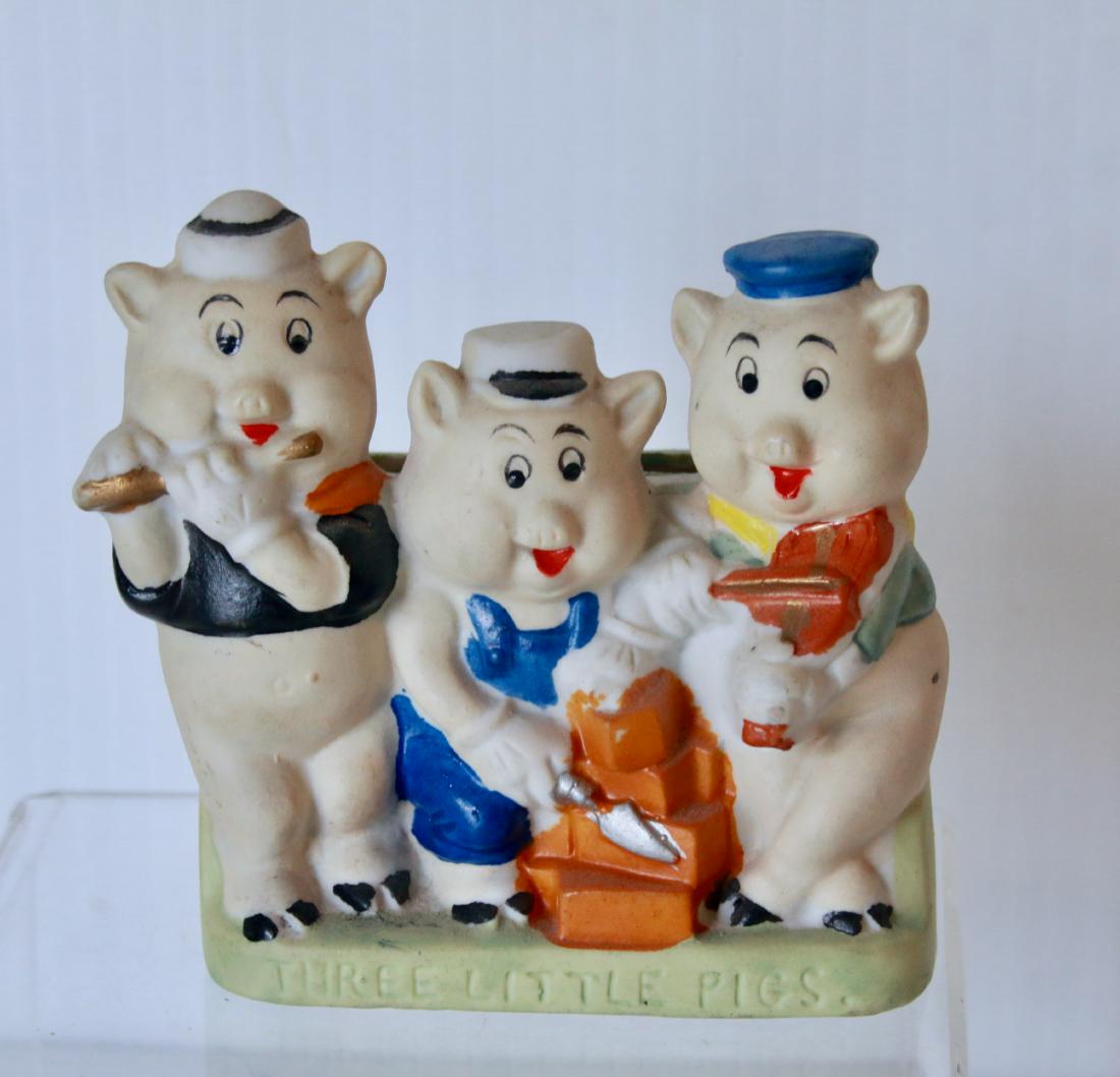 THREE LITTLE PIGS TOOTHBRUSH HOLDER: HAND PAINTED BISQUE - MADE IN JAPAN, WALT DISNEY - WITH GREEN BASE Size:4" X 4"