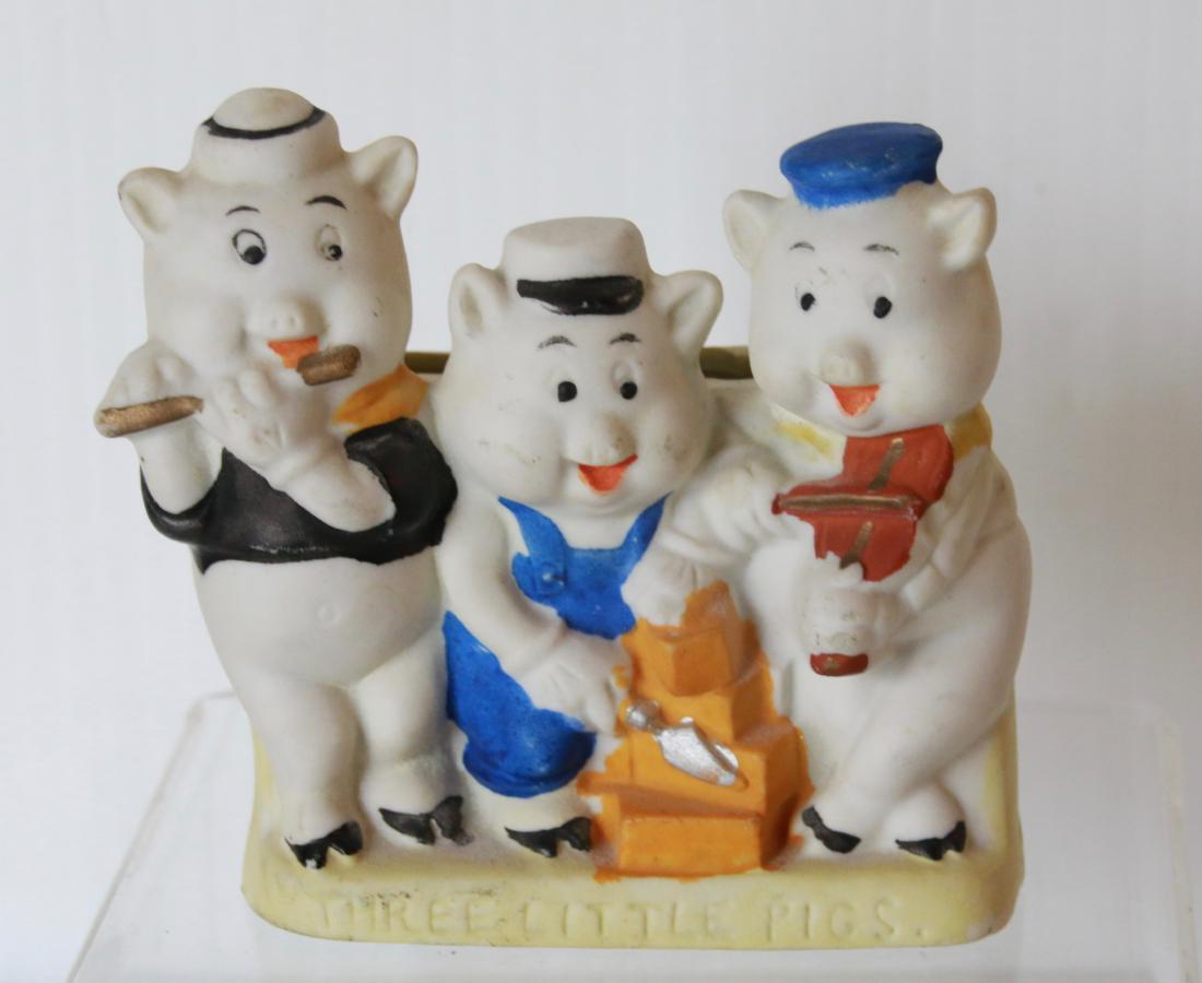 THREE LITTLE PIGS TOOTHBRUSH HOLDER: HAND PAINTED BISQUE - MADE IN JAPAN - WALT DISNEY - WITH YELLOW BASE Size:4" X 4"
