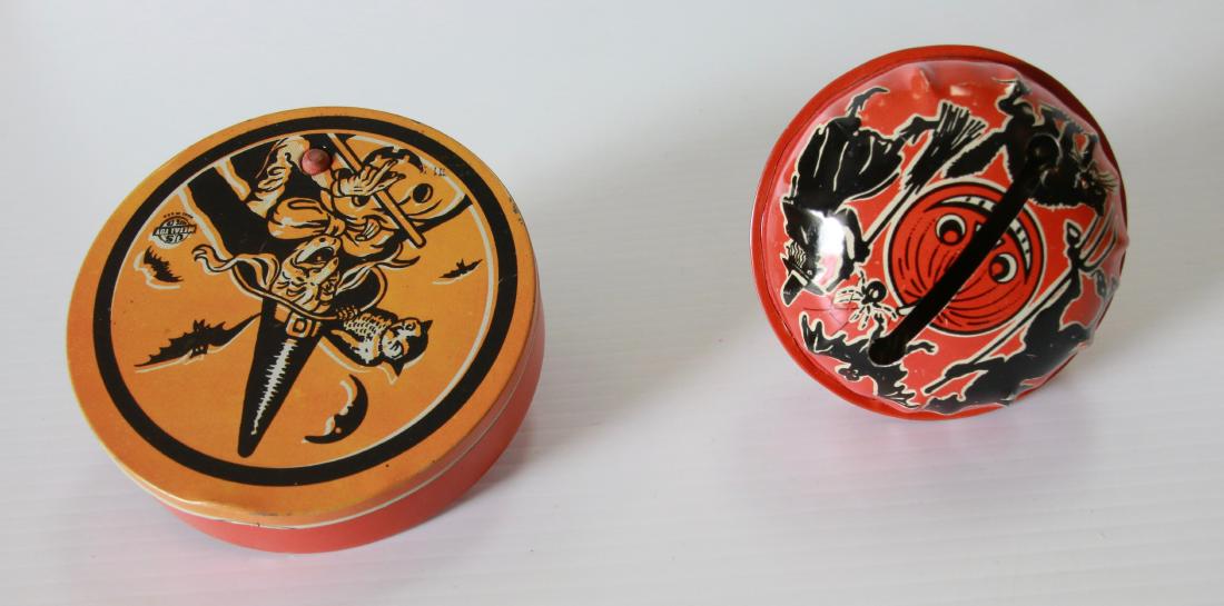 PR. OF HALLOWEEN NOISEMAKERS: TIN LITHO - MARKED "LIFE OF THE PARTY" PRODUCTS - AND NOISE MAKER WITH A WITCH MARKED "U.S. METAL TOY" Size:3 1/2" AND 4" DIAMETER