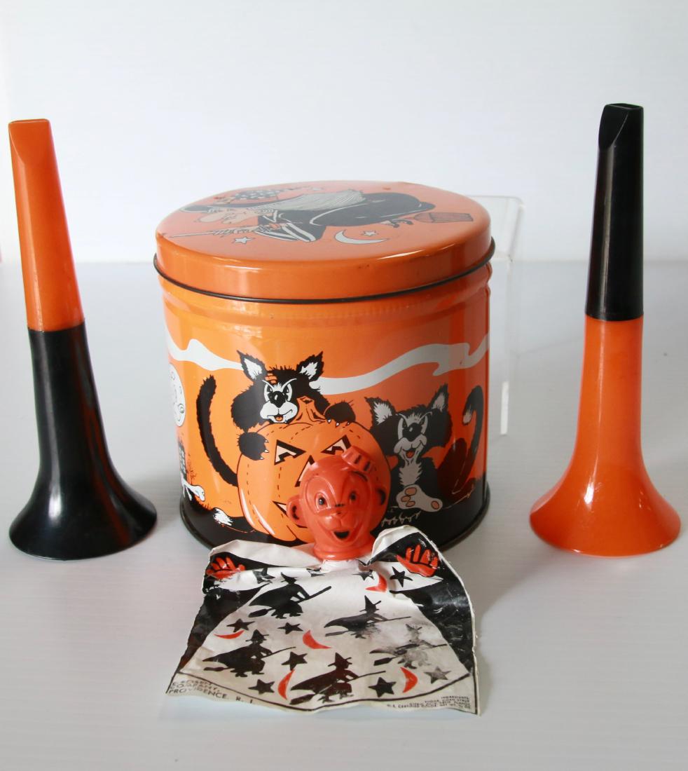 GROUP LOT IF VINTAGE HALLOWEEN: TIN LITHO CONTAINER, (2) PLASTIC HORNS, AND MONKEY PUPPET