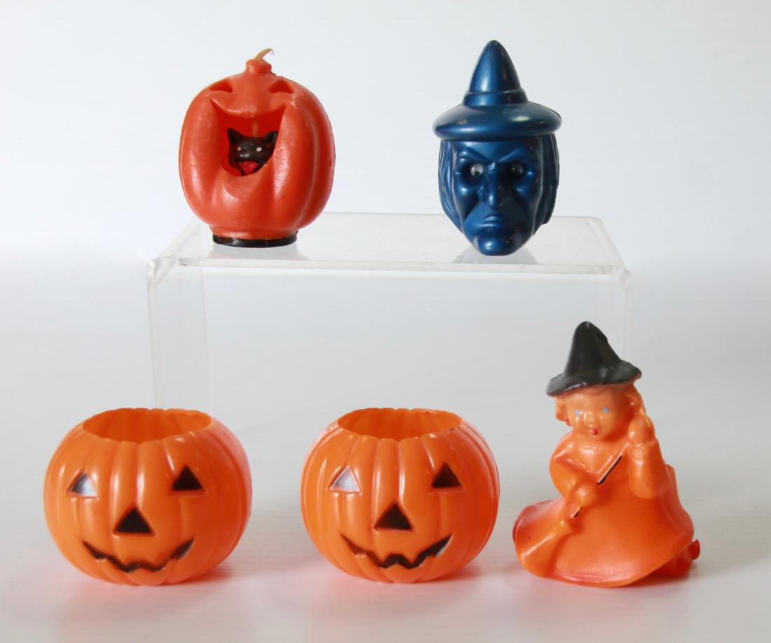 GROUP LOT OF HALLOWEEN DECORATIONS: (5) PIECES INCLUDING - (2) MOLDED PLASTIC PUMPKINS, (2) CANDLES, AND PLASTIC WITCH HEAD Size:1 1/2" TO 3 1/2"