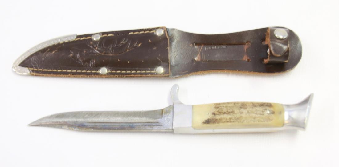 HUNTING KNIFE IN SHEATH: HAND TOOLED LEATHER SHEATH WITH ELK HEAD, BLADE MARKED OTHELLO G.C.CO. #033 - ANTLER HANDLE 4 3/4" BLADE