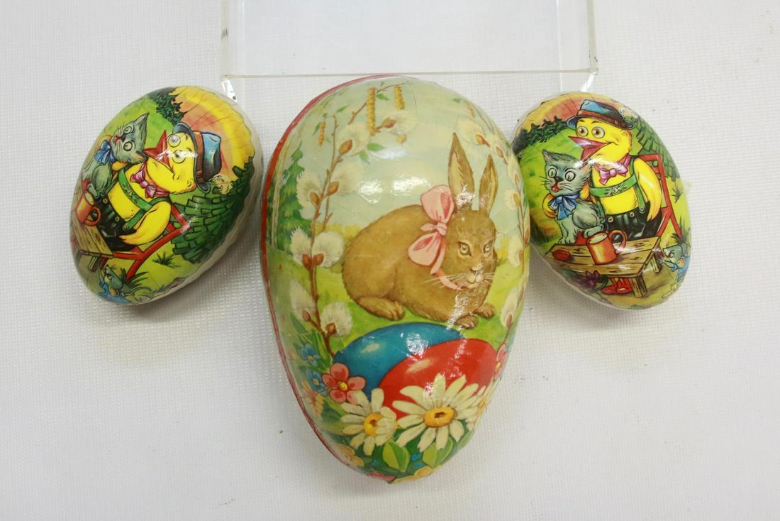 GROUP LOT OF EASTER CANDY CONTAINERS: THREE EGG SHAPED CONTAINERS. TWO SMALL ARE MARKED "GERMAN DEMOCRATIC REPUBLIC". LARGER MARKED "WESTERN GERMANY"