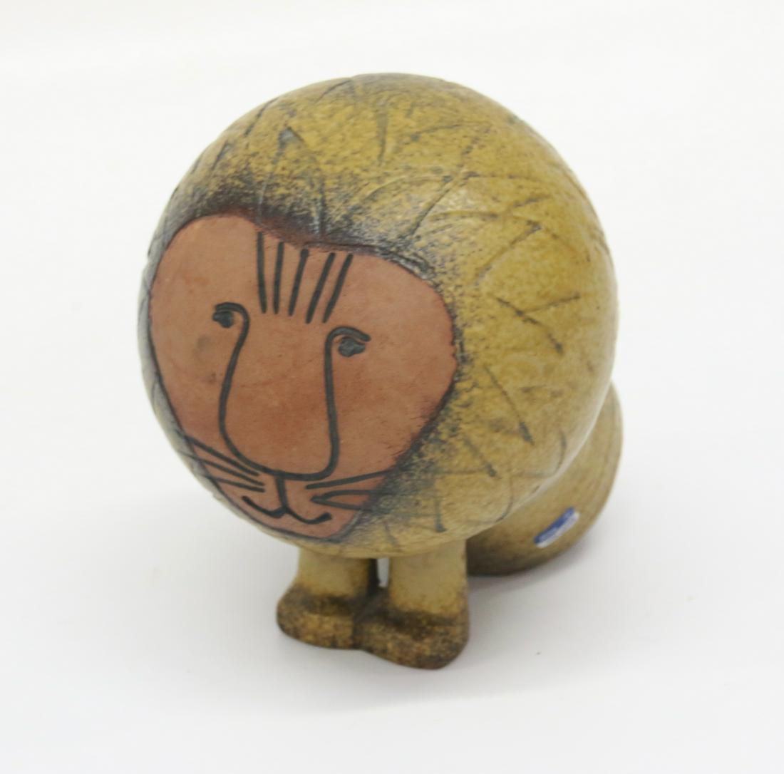 LISA LARSON POTTERY LION: POTTERY LION WITH ORIGINAL LABEL. MARKED ON BOTTOM