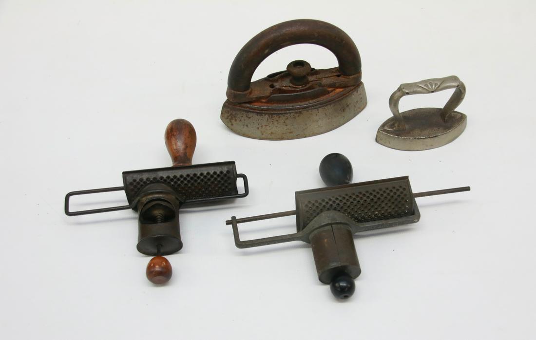 GROUP LOT OF COUNTRY SMALLS: FOUR INCLUDING: TWO NUTMEG GRATERS (ONE PATD 1891) AND TWO MINIATURE IRONS