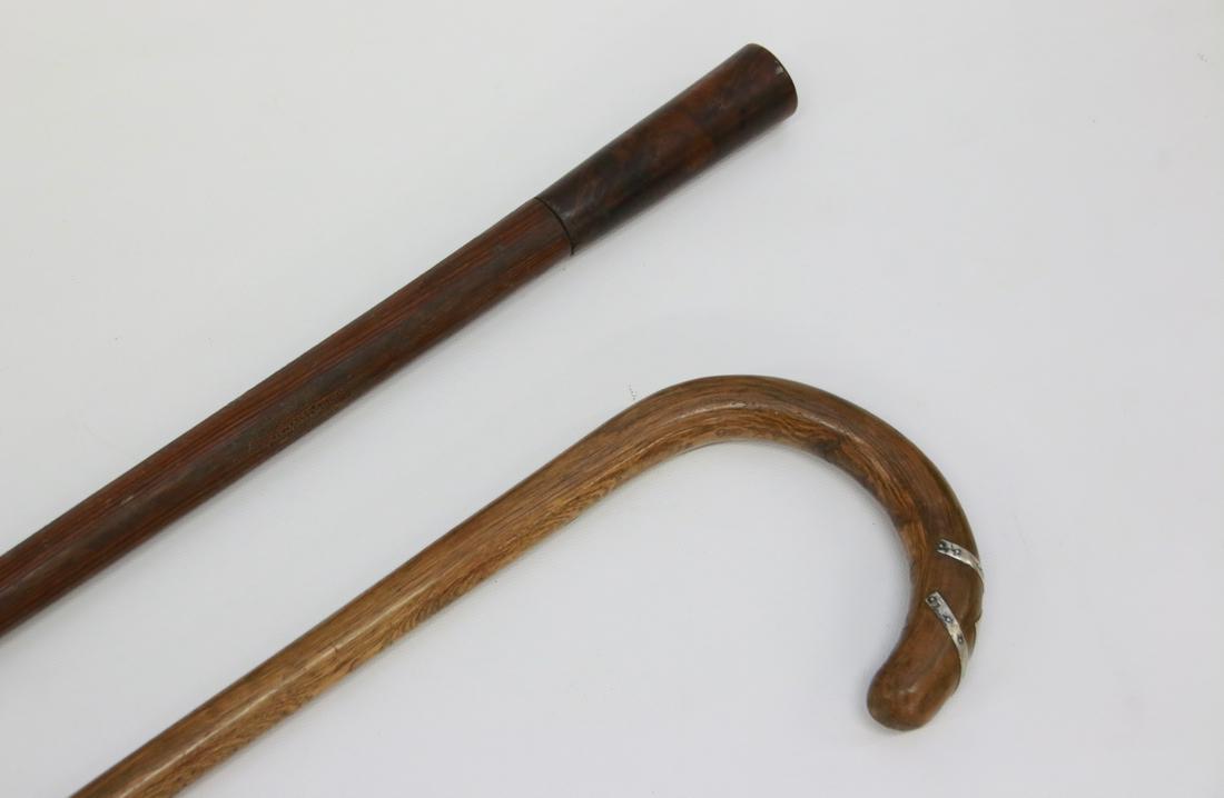 PAIR OF WOODEN CANES: THE CANE WITH SILVER DECORATION AND THE WALKING STICK HAS FIGURED WOOD TOP