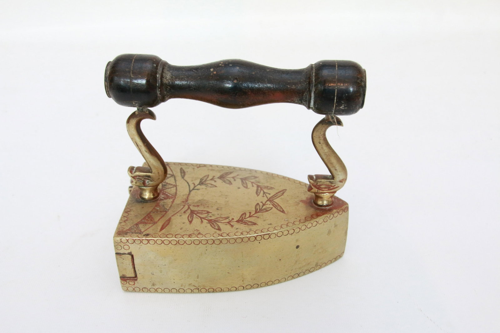 BRASS SLUG IRON: ENGRAVED TOP SURFACE - STYLIZED DOLPHIN POSTS Size: 5 3/4"