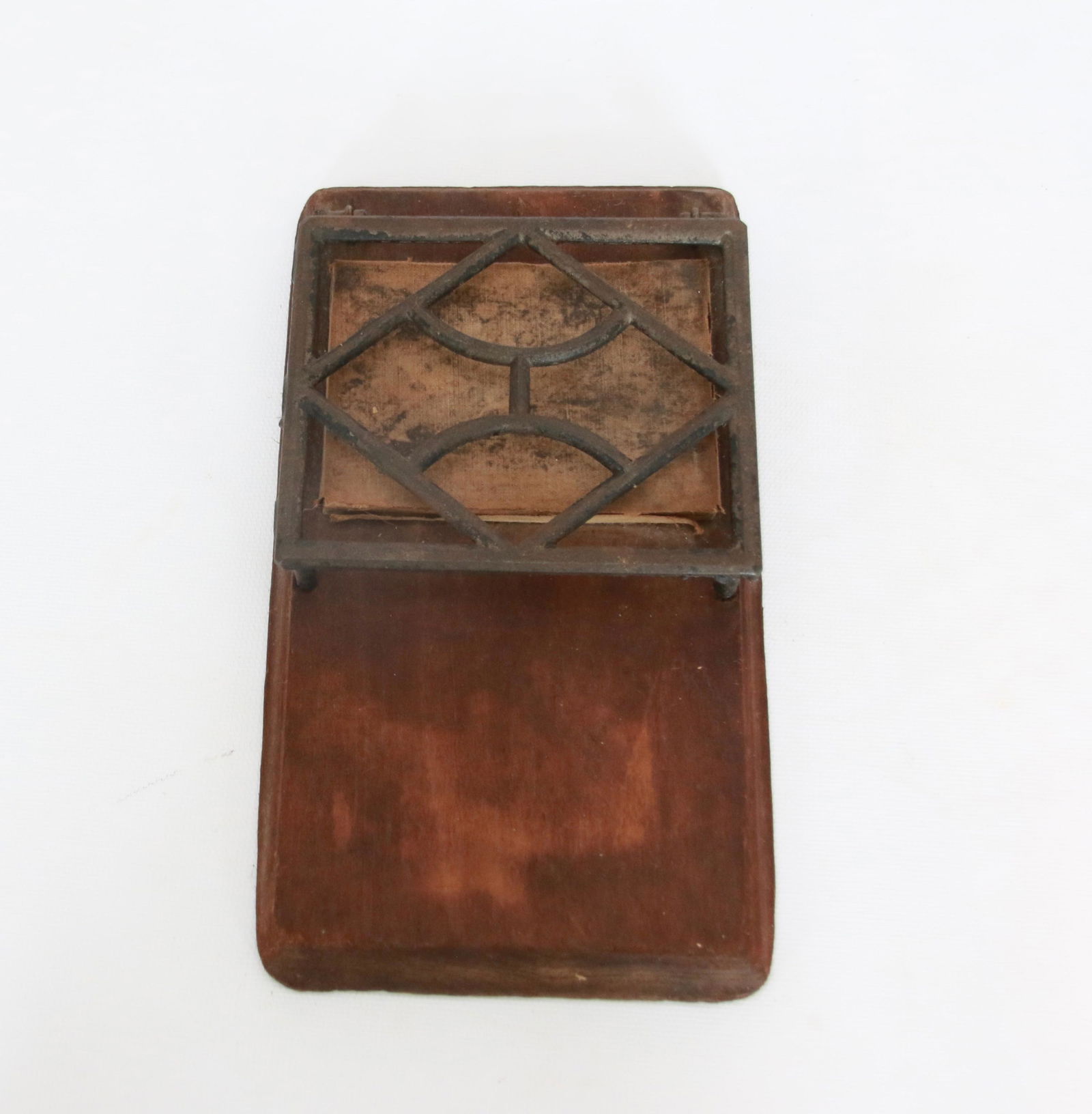 CAST IRON TRIVET: CAST IRON TRIVET ON IRON CLEANING BOARD Size: 8 1/2"