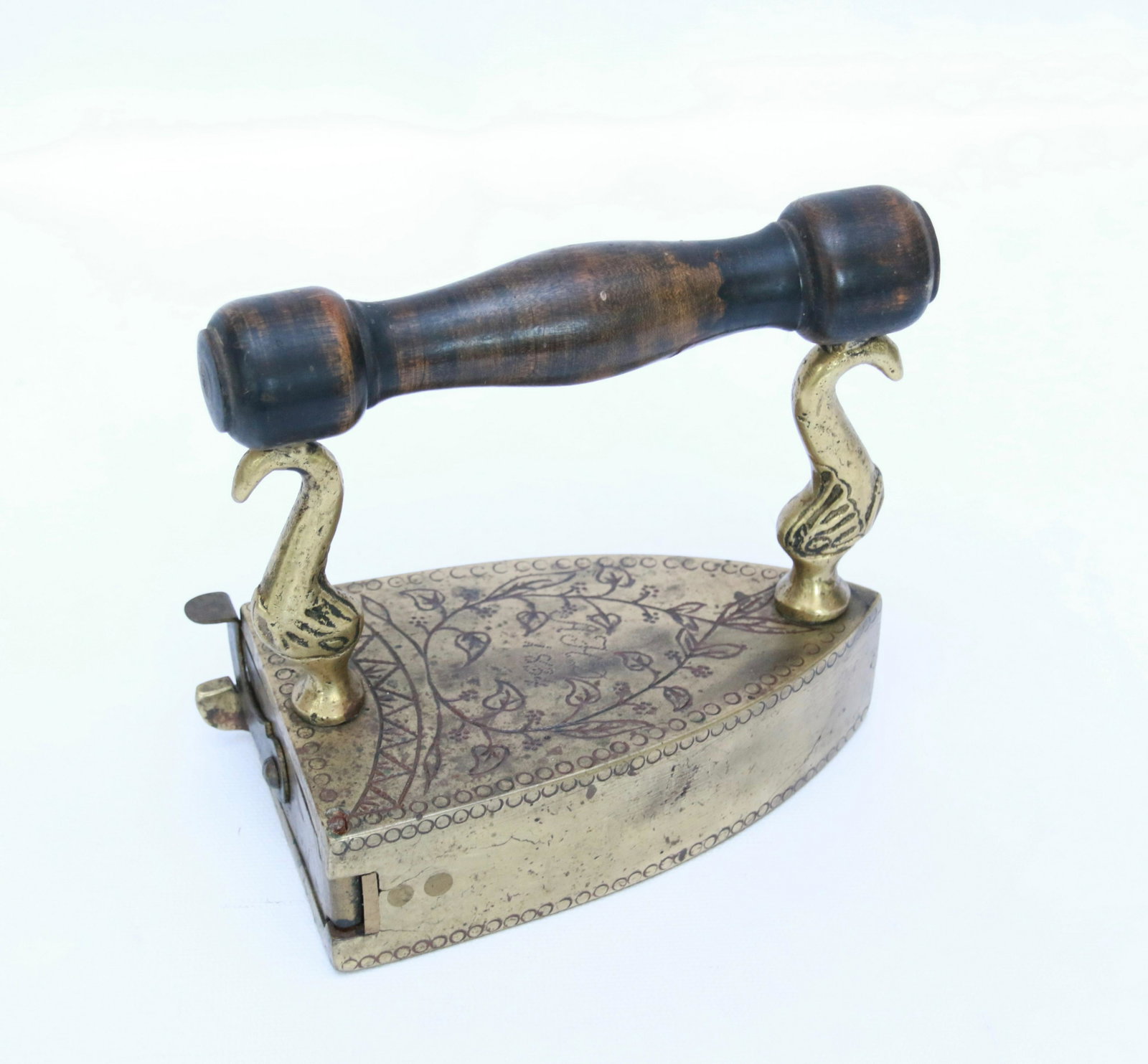 HIGHLY ENGRAVED BRASS SLUG IRON: HIGHLY ENGRAVED DATED "1834" WITH DOLPHIN POSTS Size: 5 3/4"