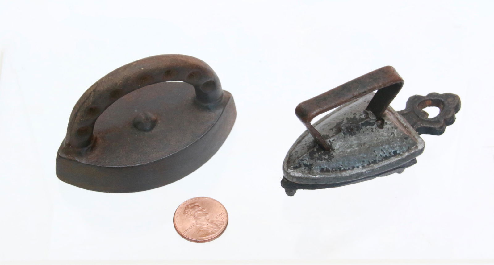 LOT OF SMALL SAD IRONS: SOLID CAST ENTERPRISE WITH HOLES LEAD MINIATURE, AND CAST IRON SMALL TRIVET Size: