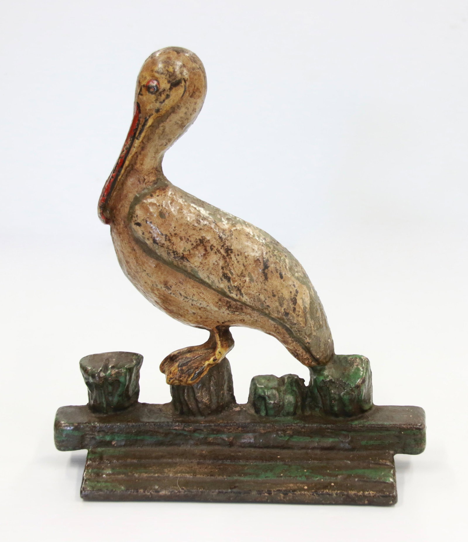 VINTAGE CAST IRON PELICAN DOOR STOP: RARE "PELICAN AT THE PIER" DOOR STOP IN ORIGINAL PAINT - CIRCA 1910 - WEDGE DESIGN Size: 7" X 8"