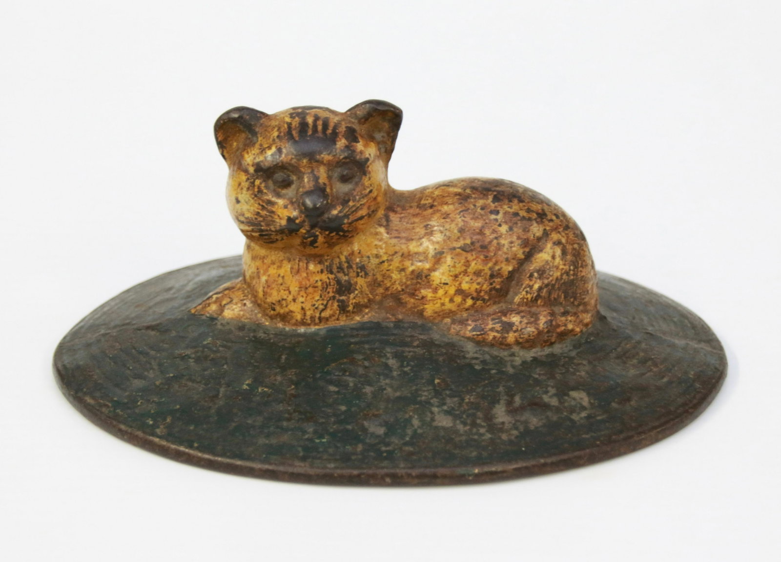 CAST IRON CAT DOOR STOP: CAT ON A RUG DOOR STOP IN ORIGINAL PAINT Size: 6 3/4" X 5 1/2" X 2 1/2"