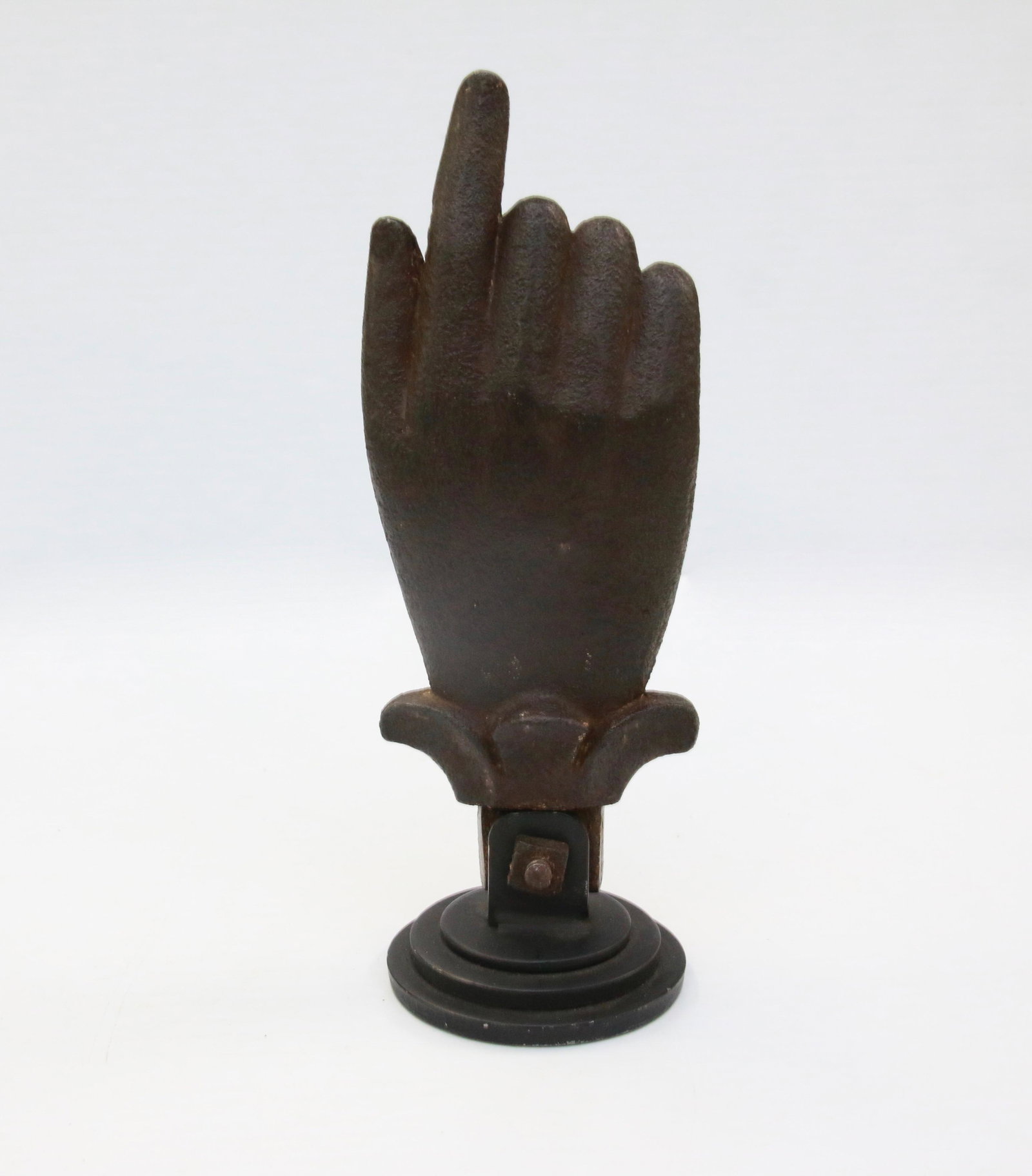 19TH CENTURY CAST IRON WEIGHT: IN THE FORM OF A HAND WITH POINTING FINGER, MOUNTED ON MODERN BASE Size: 8" H