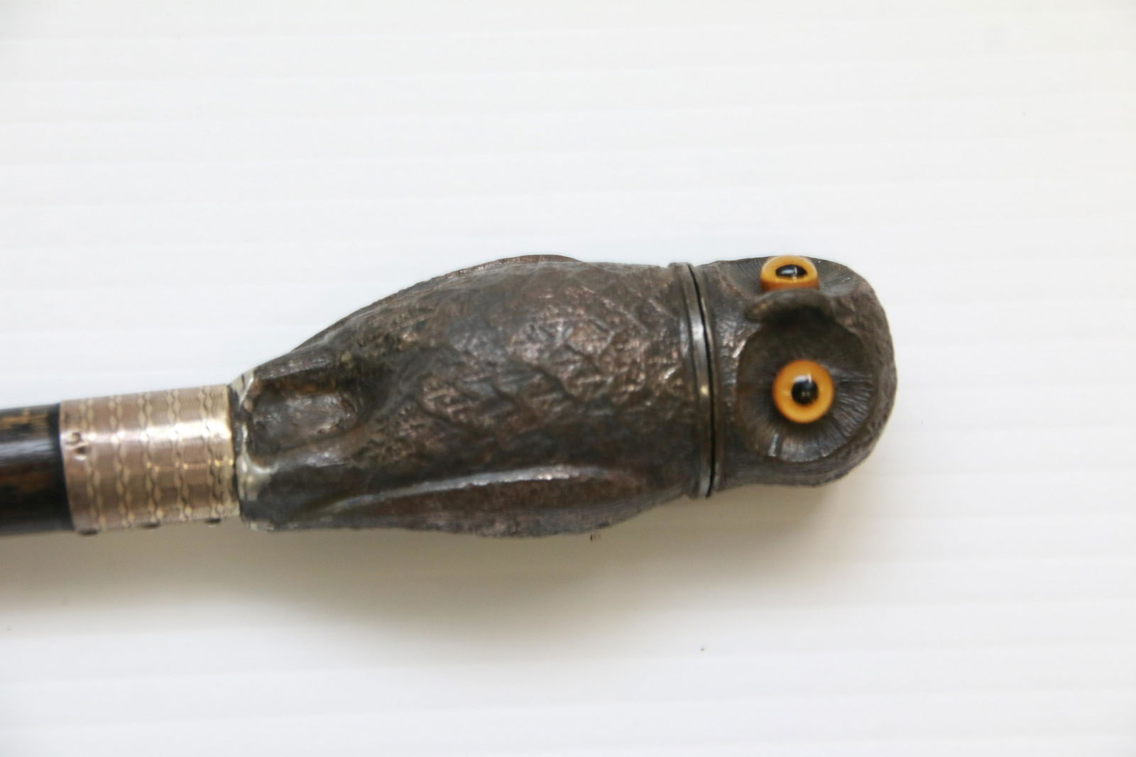 ANTIQUE FIGURAL WALKING STICK: METAL OWL WITH GLASS EYES CANE TOP - OWL IS A NUTMEG GRATER - EBONY SHAFT - SILVER BANDED WITH HALLMARKS Size: 38 1/2"