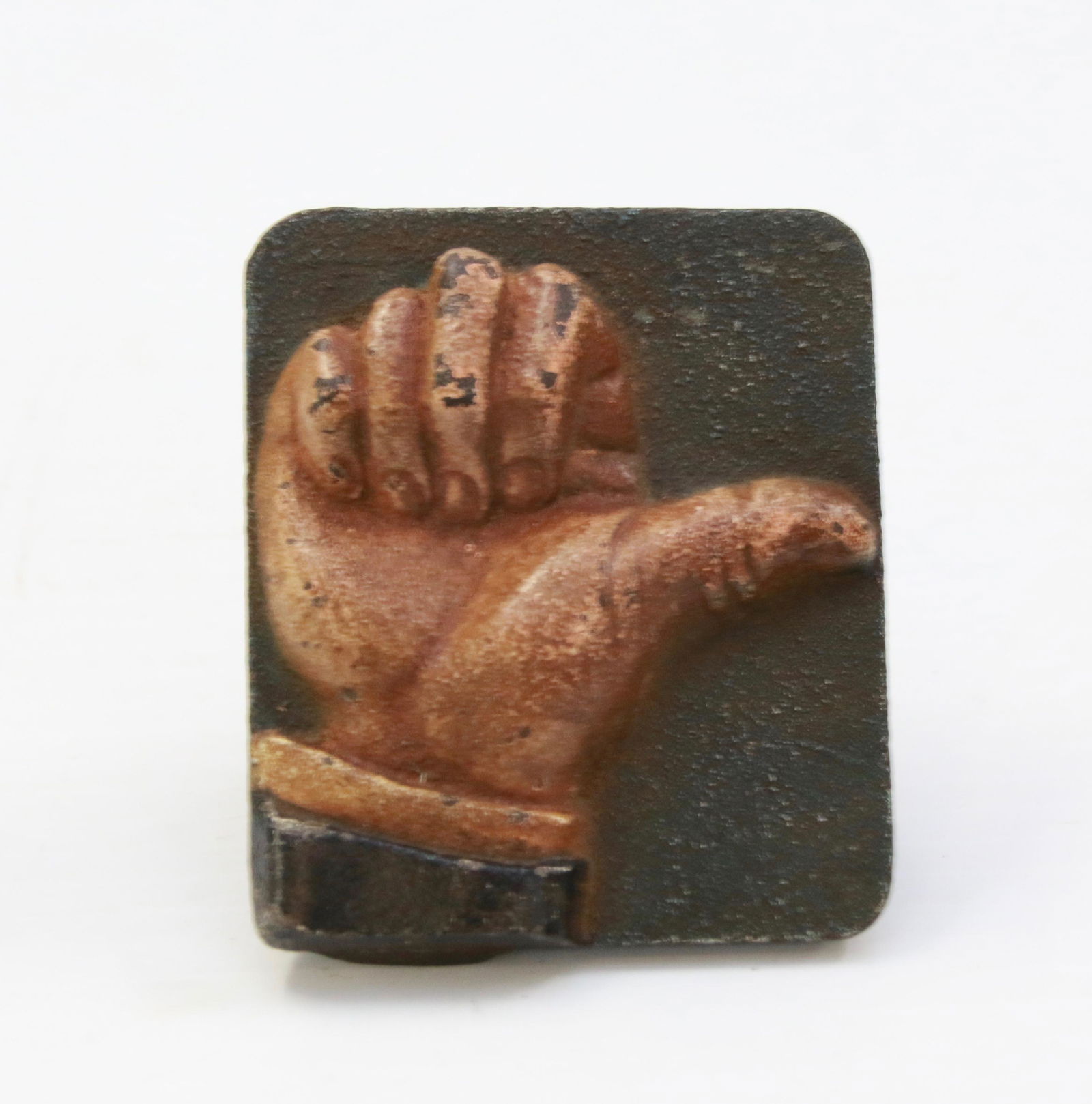 CAST IRON THUMBS UP: WINDOW DISPLAY IN A SMALL SIZE WITH PAINTED THUMBS UP - MARKED "GO GO GO !" ON BACK - THUMBS UP FOR YES THUMBS DOWN FOR NO Size: 2 1/2" X 2 1/4"