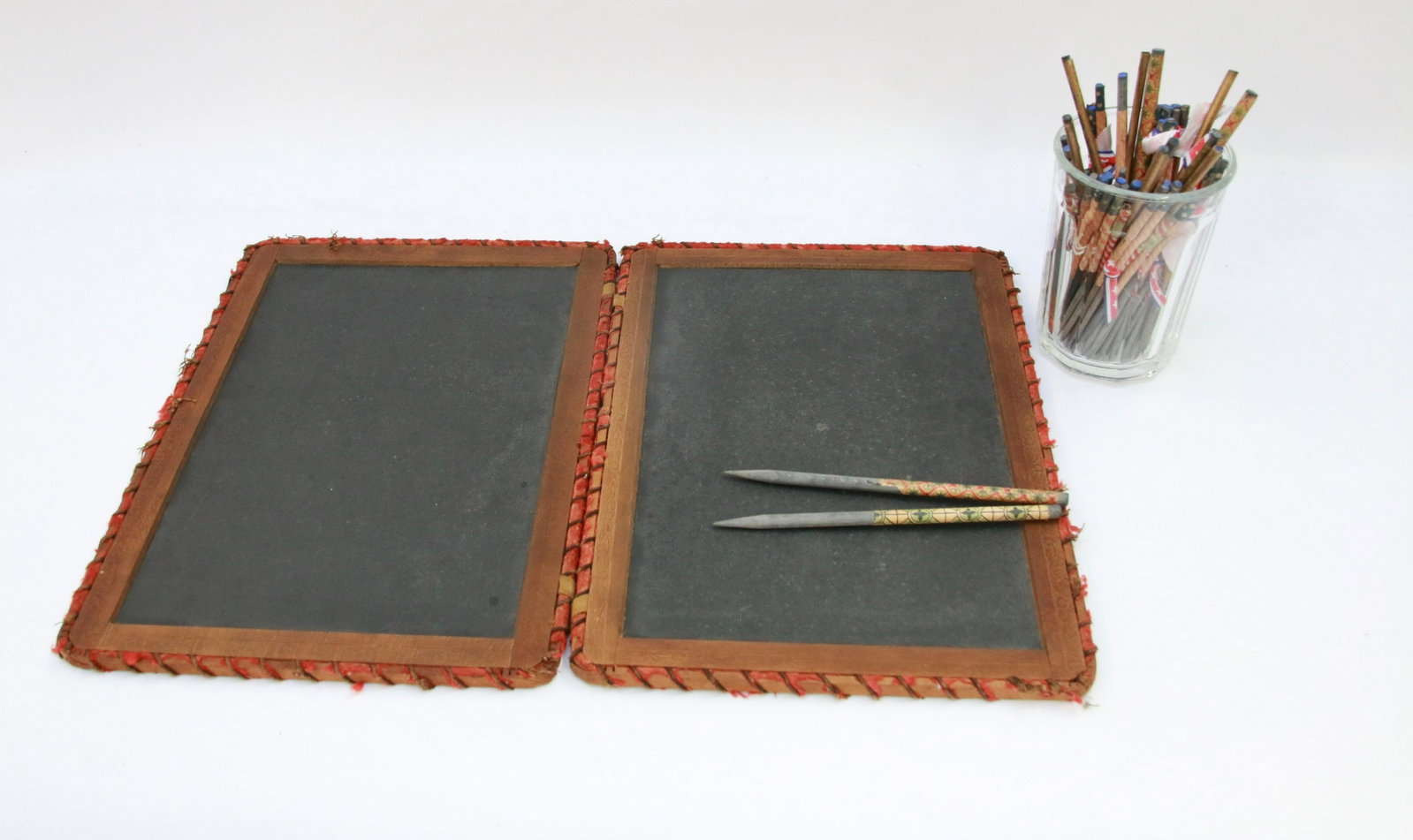 FOLDING SLATE BOARD: PAIR OF SLATE BOARDS HINGED IN THE MIDDLE WITH (40 PLUS) SLATE PENCILS Size: 9 3/4" X 13 3/4"