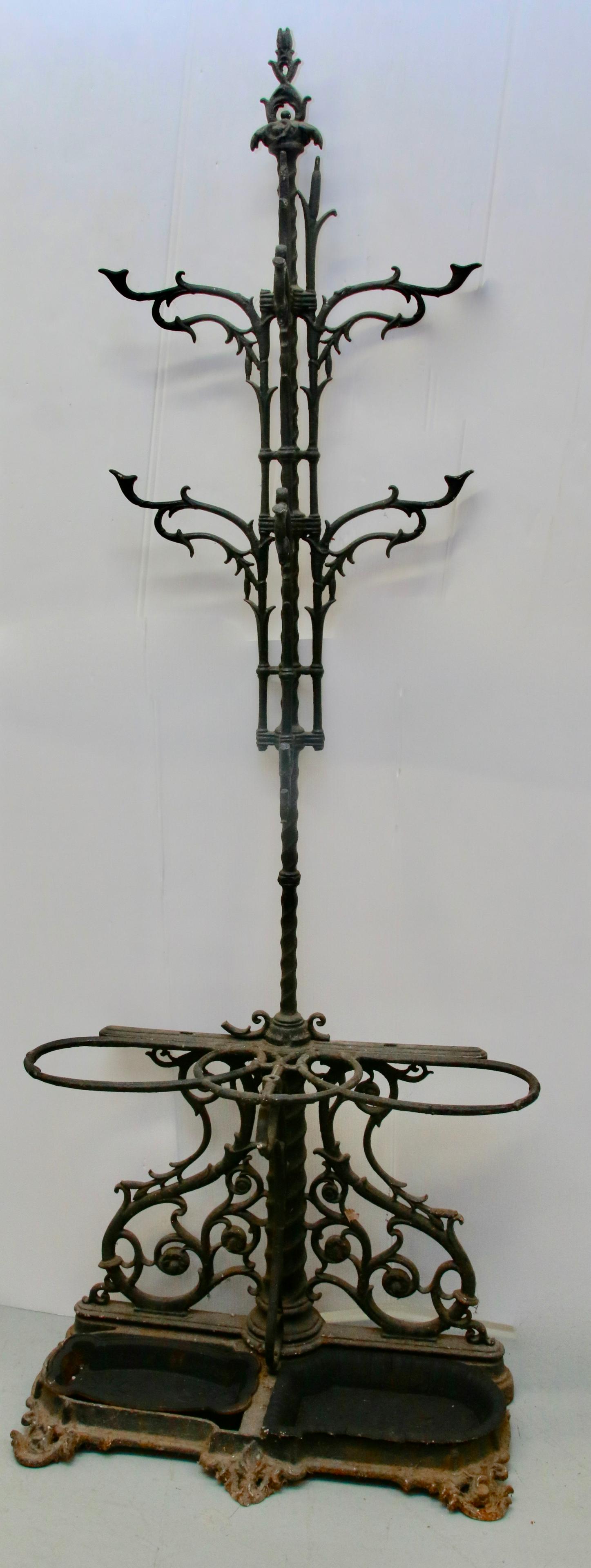 19TH CENTURY CAST IRON HALL RACK: WITH CAST IRON HOOKS AND UMBRELLA HOLDERS Size: 78" H X 30 1/2" X 13"