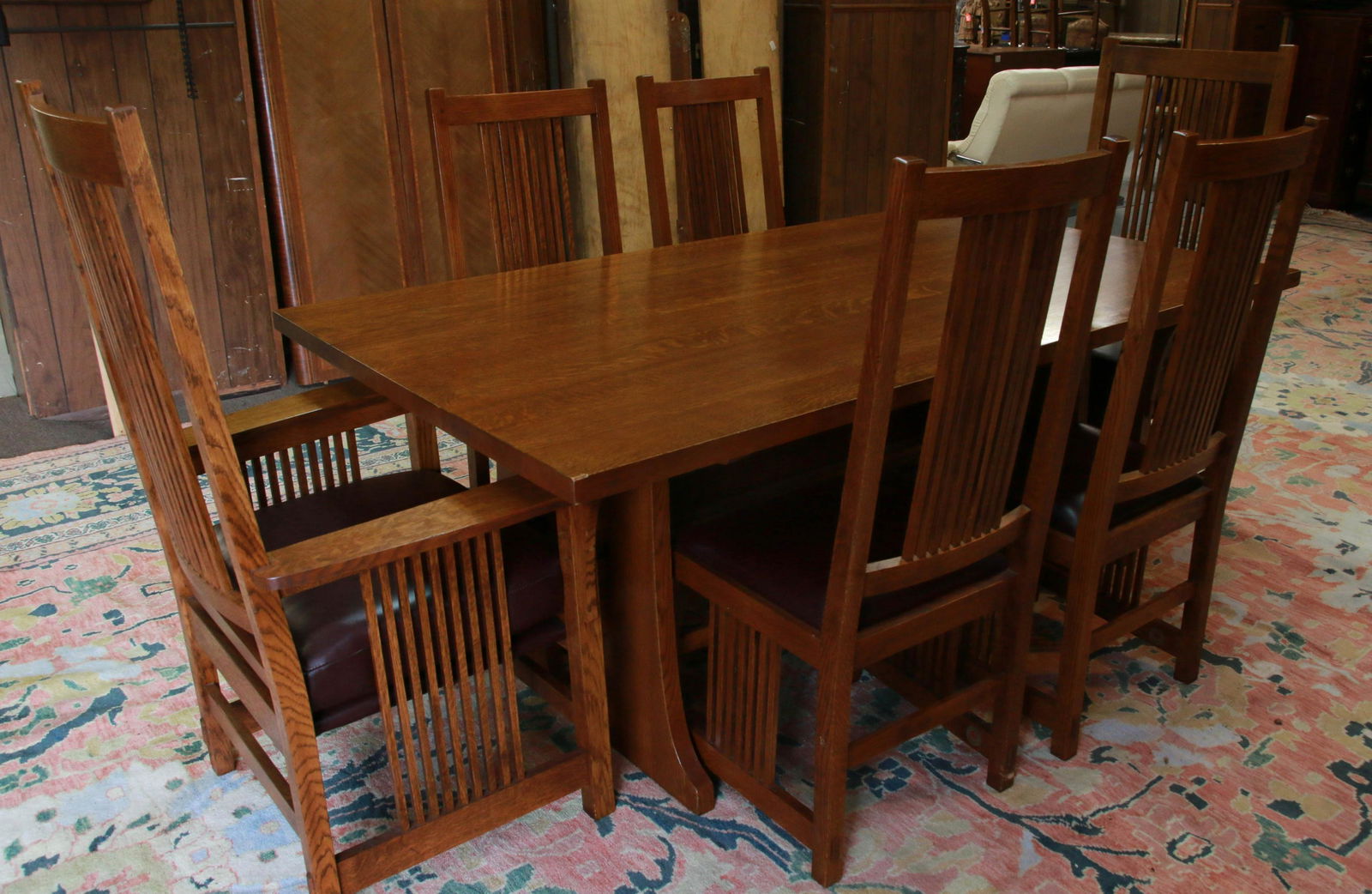 L & J.G. STICKLEY TABLE AND CHAIRS: MISSION STYLE OAK TABLE WITH 2 LEAVES AND 6 CHAIRS (4 SIDE - 2 ARM) - BRANDED - (MFG. 2006) #52 Size: 42" X 76" X 29" H - (LEAVES 15") CHAIRS (SIDE) 17" X 18" X 45" (ARM) 28" X 21" X 49"