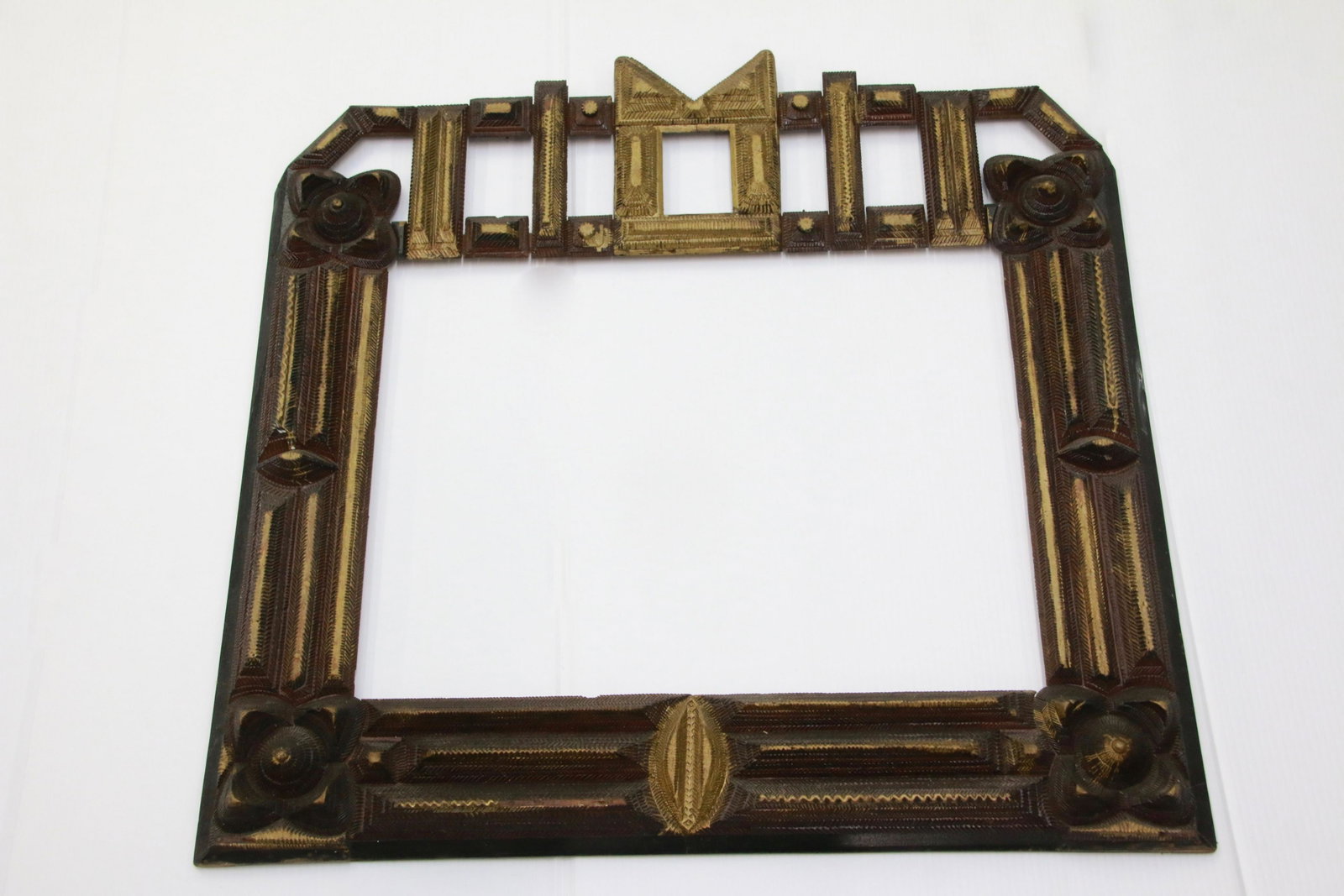 TRAMP FOLK ART FRAME: CHIP CARVED IN UNUSUAL DESIGN - GOLD AND DARK RED PAINTED - INTERIOR MEASURE 19 7/8" X 14 7/8" 28 1/2" X 27 1/2" TOTAL SIZE