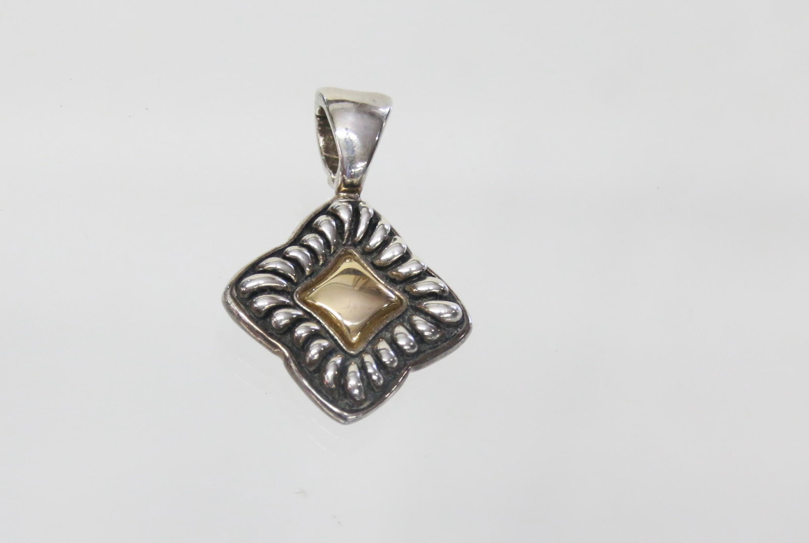 STERLING AND 14K PENDANT: BAIL HINGED - 14K INSERT .51 OZT - 1.7" X 1.25"
