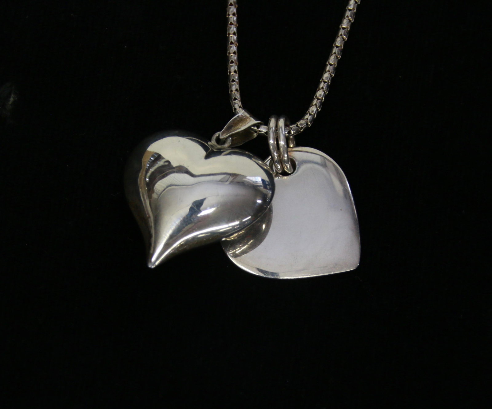 (2) STERLING HEARTS: (2) HEART PENDANTS ON CHAIN 16" CHAIN - 1.1" DIAMETER - .62 OZT