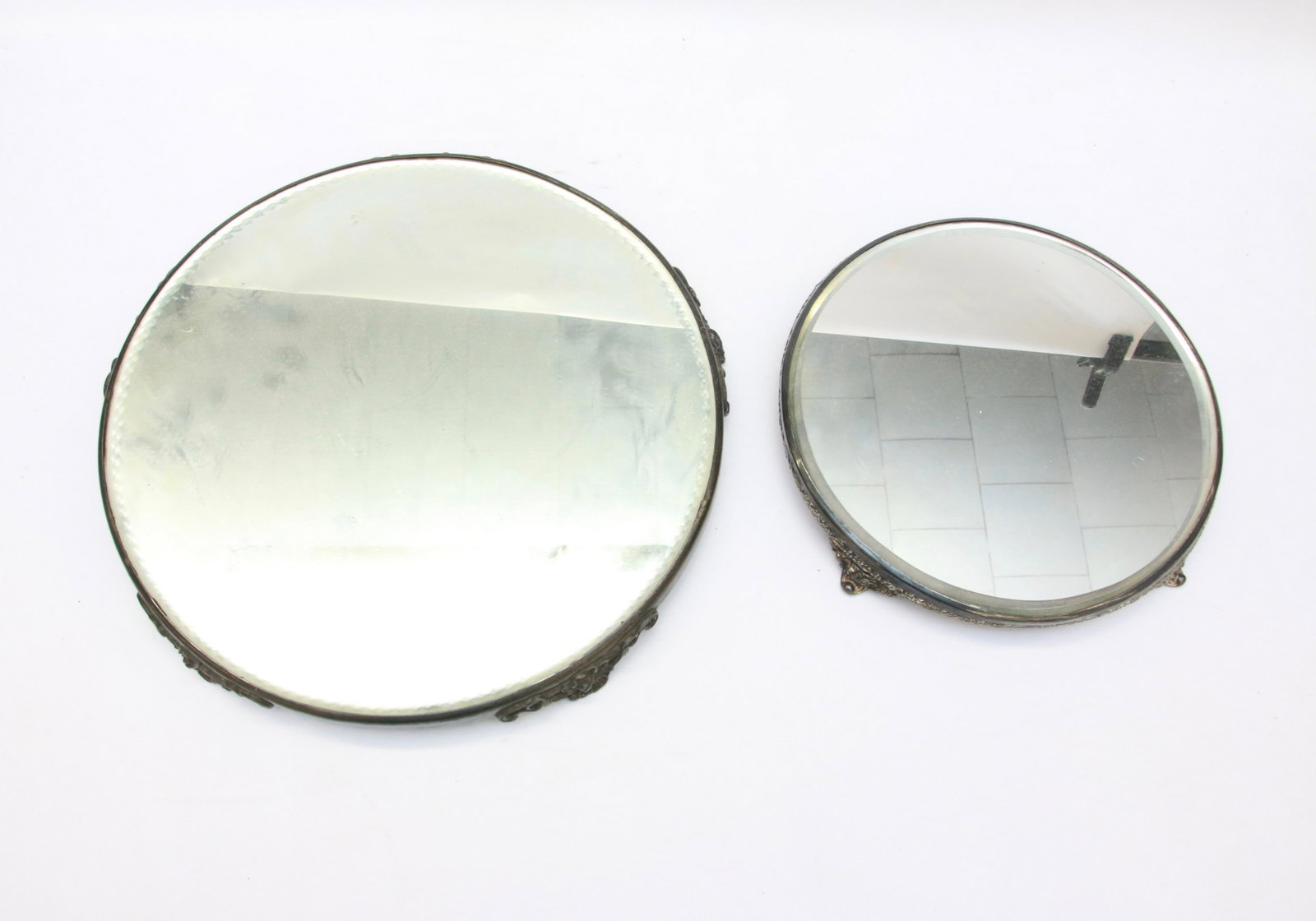 PAIR OF MIRRORED PLATEAUS: SILVERPLATE WITH BEVELED MIRRORS 10" TO 14" D