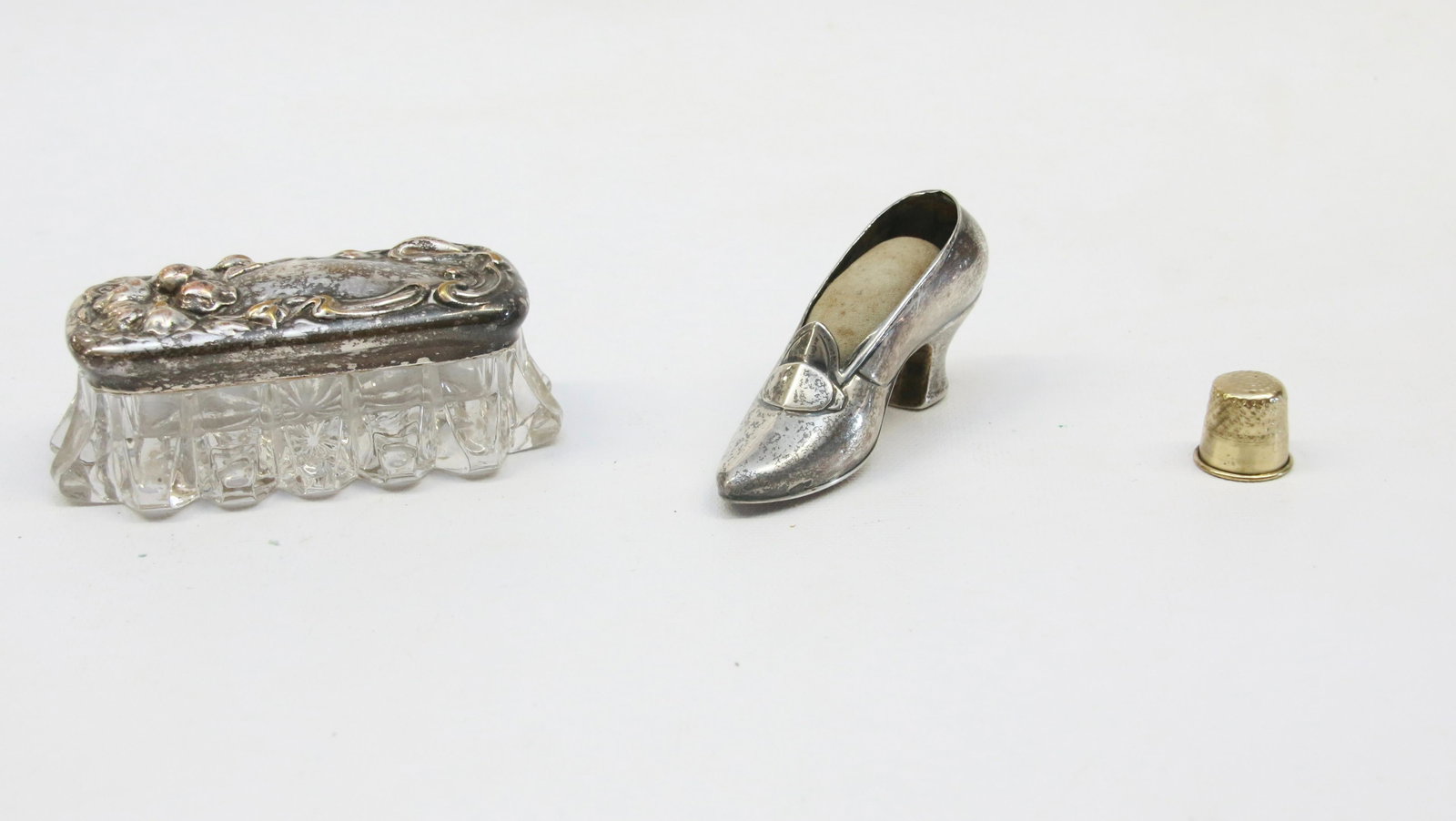 GROUP LOT OF SMALLS: INCLUDING: STERLING SILVER SHOE PIN CUSHION, SILVER PLATED COVERED GLASS BOX AND THIMBLE. SHOE MEASURES 3 1/2" L