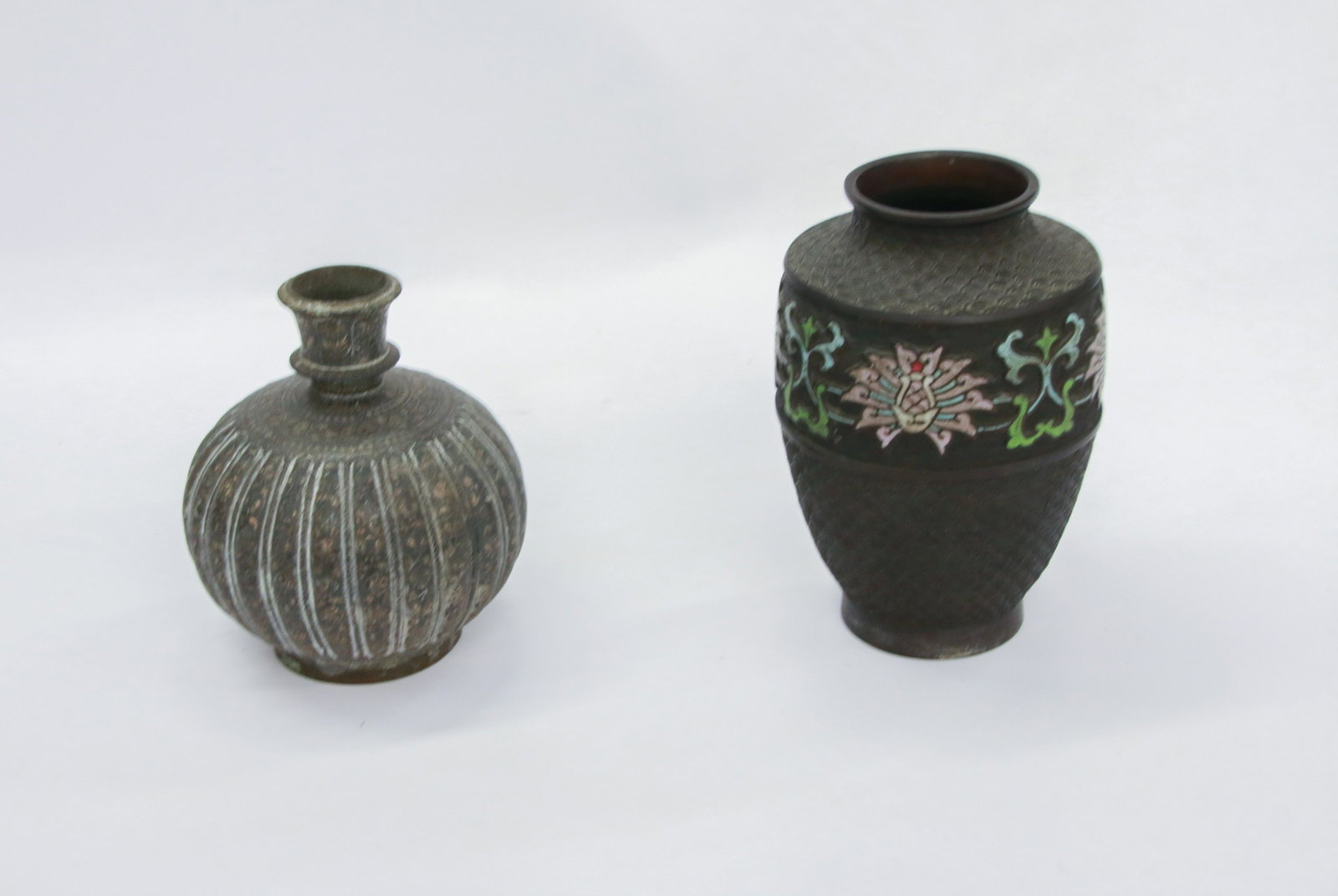 PAIR OF DECORATIVE VASES: INCLUDES: GOURD SHAPED MIDDLE EASTERN VASE (POSSIBLY BRONZE) AND TALLER VASE WITH CHAMPLEVE DECORATION 6 3/4" AND 8" H