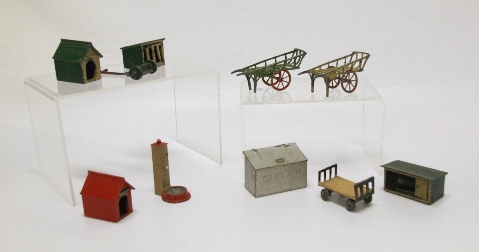 GROUP LOT OF CAST METAL MINIATURE TOYS: 10 INCLUDING: DOG HOUSES, WAGONS, CORN BIN, LAWNMOWER AND MORE Size: 1 1/2" TO 3 1/2" L.