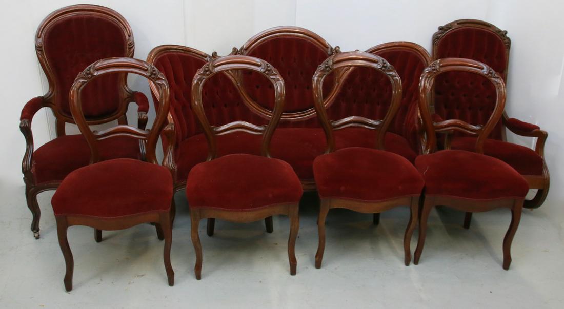 (7) PIECE VICTORIAN PARLOUR SET: INCLUDES: SETTEE, ARMCHAIR, ROCKING CHAIR AND FOUR SIDE CHAIRS. WALNUT WITH RED VELVET UPHOLSTERY Size: SETTEE MEASURES 62" X 26" X 37"