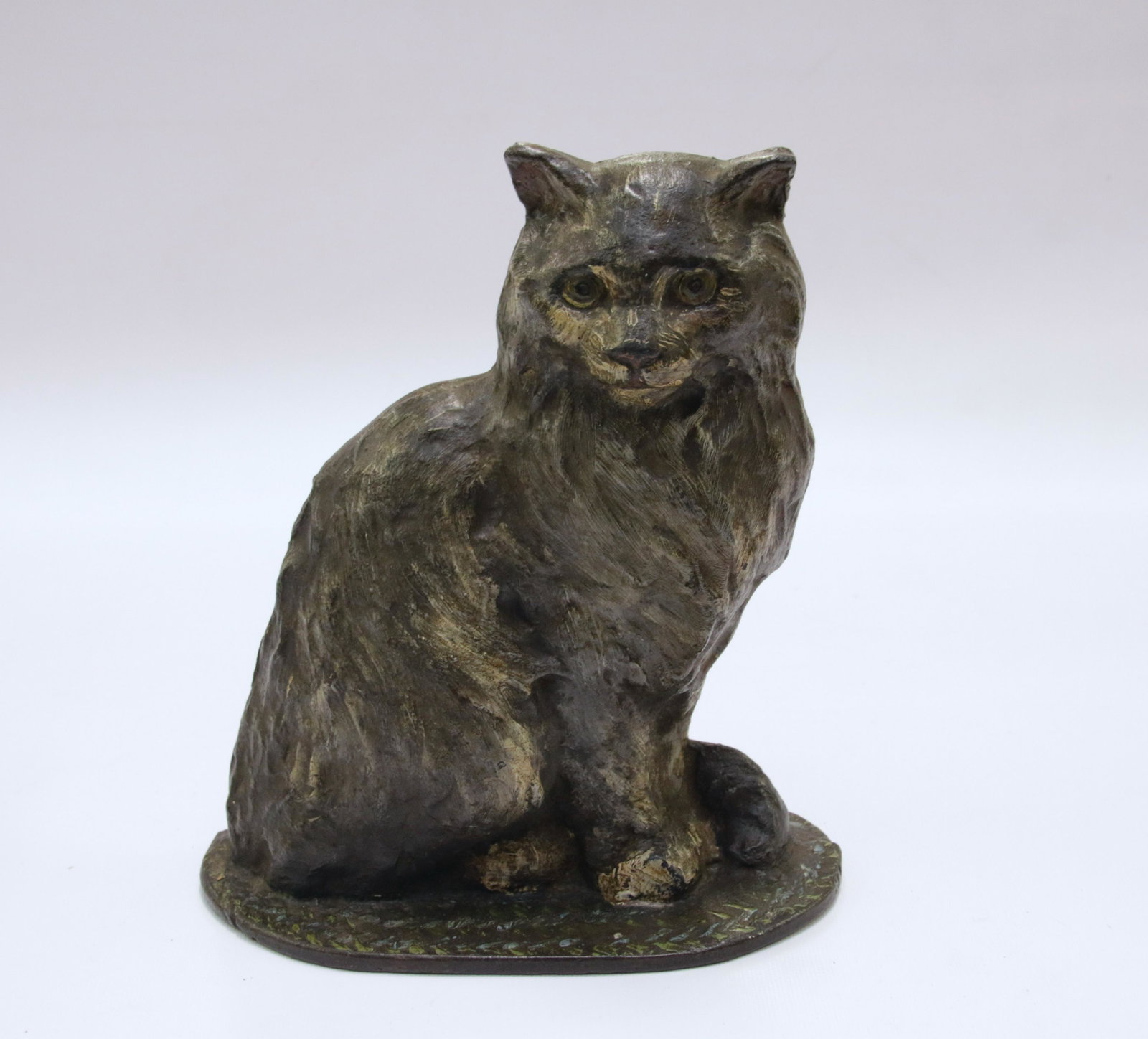CAST IRON CAT DOOR STOP: EARLY 20TH CENTURY CAT DOOR STOP ON A RUG IN ORIGINAL PAINT - ATTRIBUTED TO NATIONAL FOUNDRY Size: 8 1/4" H X 7 3/4" W We do not give IN-HOUSE shipping quotes. Please email japakmail@earthlink.net - A