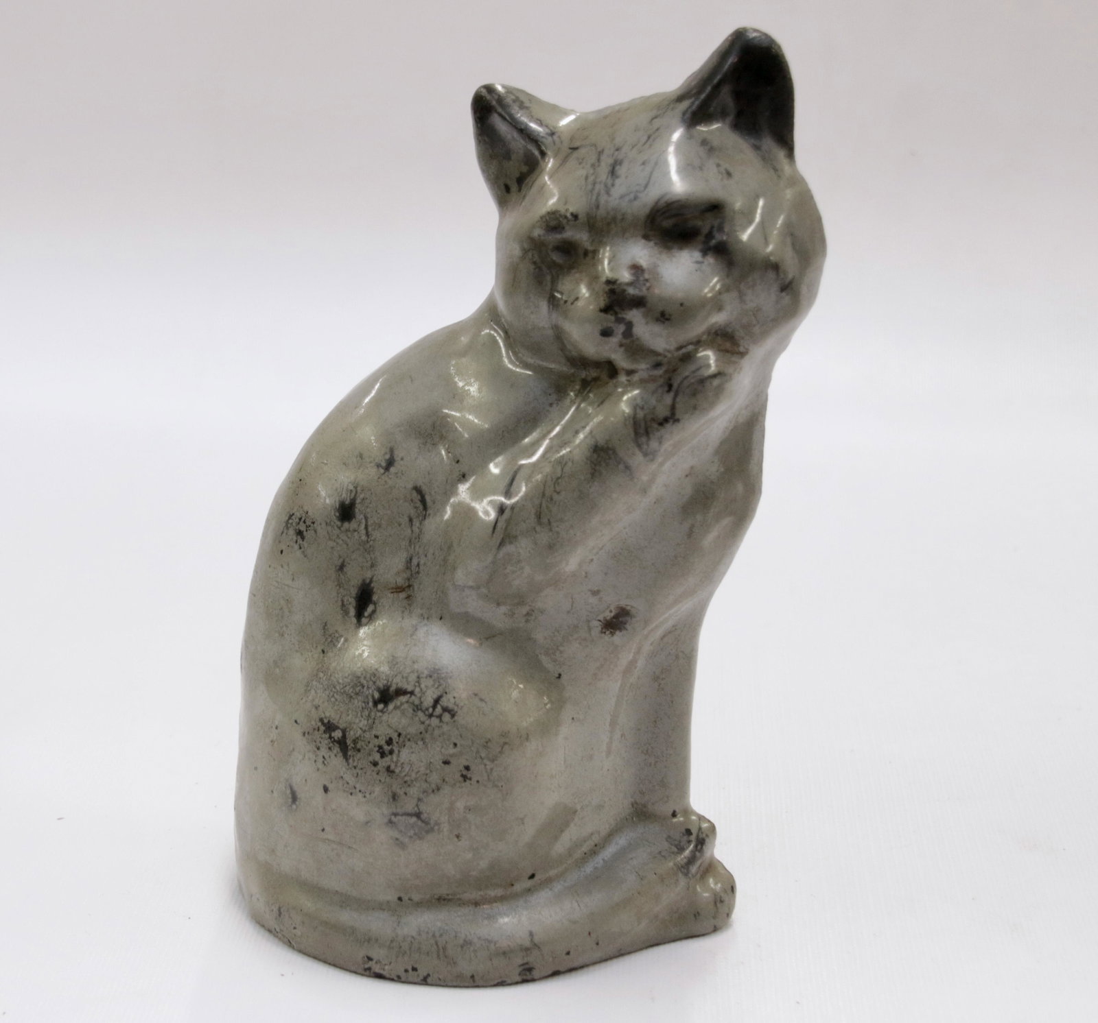 CAST IRON AND PORCELAIN DOOR STOP: GREY CAST IRON WITH PORCELAIN OVERLAY CAT DOOR STOP "LICKING PAW" Size: 7 1/4" H X 4 1/4" W We do not give IN-HOUSE shipping quotes. Please email japakmail@earthlink.net - All items once paid will be 