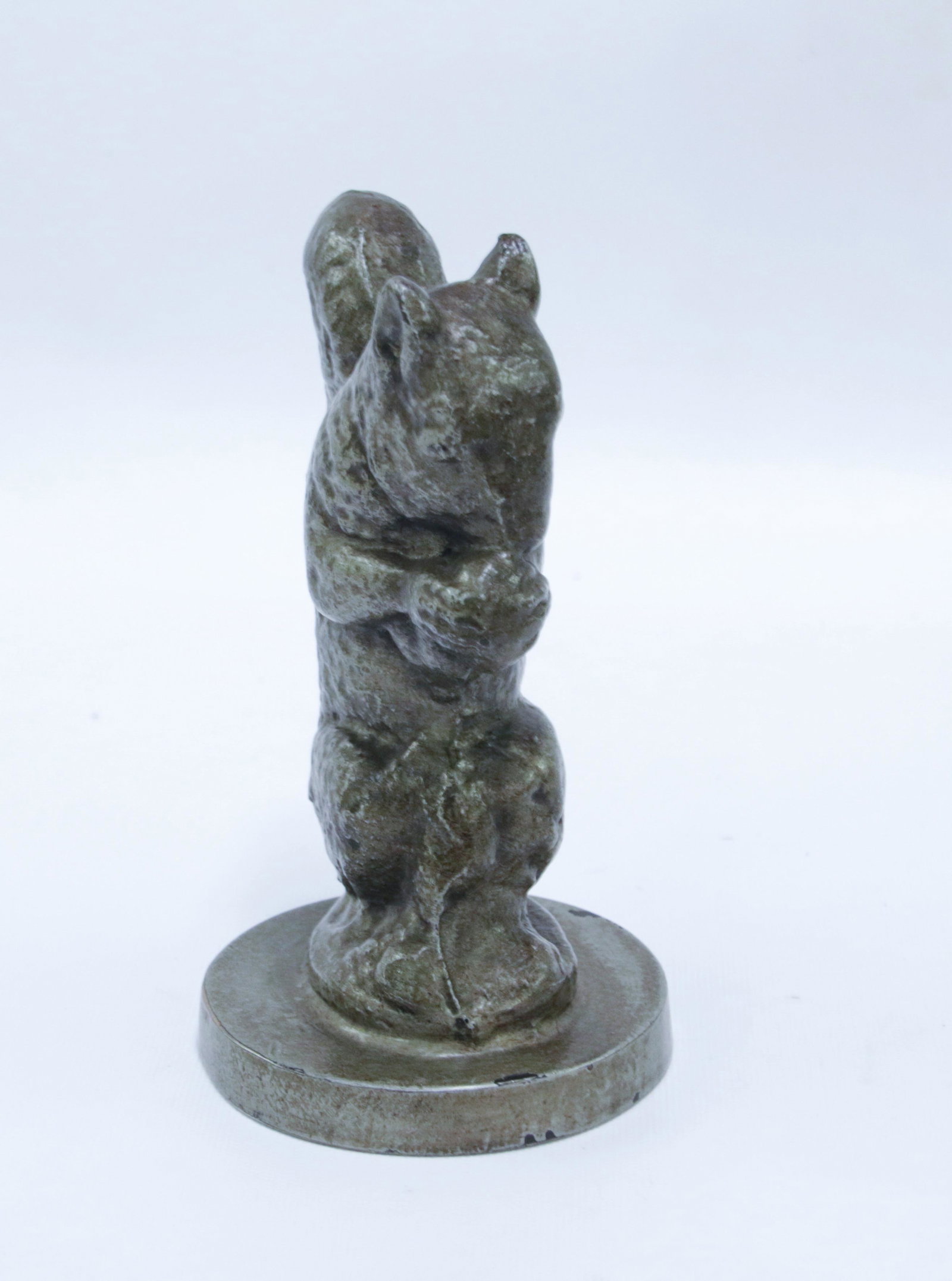 CAST IRON SQUIRREL DOORSTOP: PAINTED SQUIRREL WITH NUT ON CIRCULAR BASE - EARLY 20TH CENTURY Size: 6 1/2" H 3 1/2" W We do not give IN-HOUSE shipping quotes. Please email japakmail@earthlink.net - All items once paid will be take