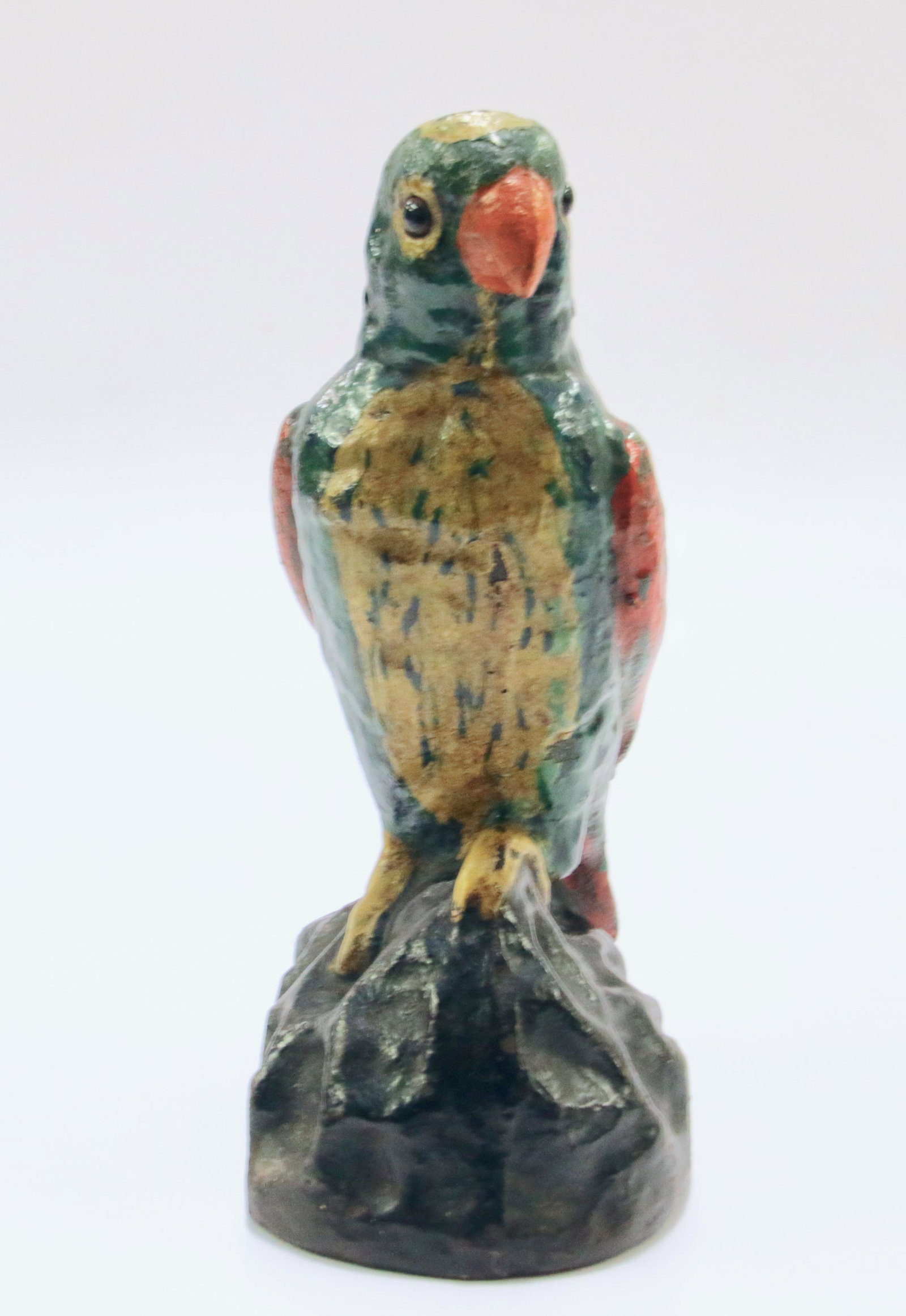 CAST IRON PARROT DOOR STOP: CAST IRON PAINTED PARROT WITH GLASS EYES ON ROCK DESIGN BASE - TURN OF THE CENTURY Size: 9" H X 3 1/2" W We do not give IN-HOUSE shipping quotes. Please email japakmail@earthlink.net - All items once 