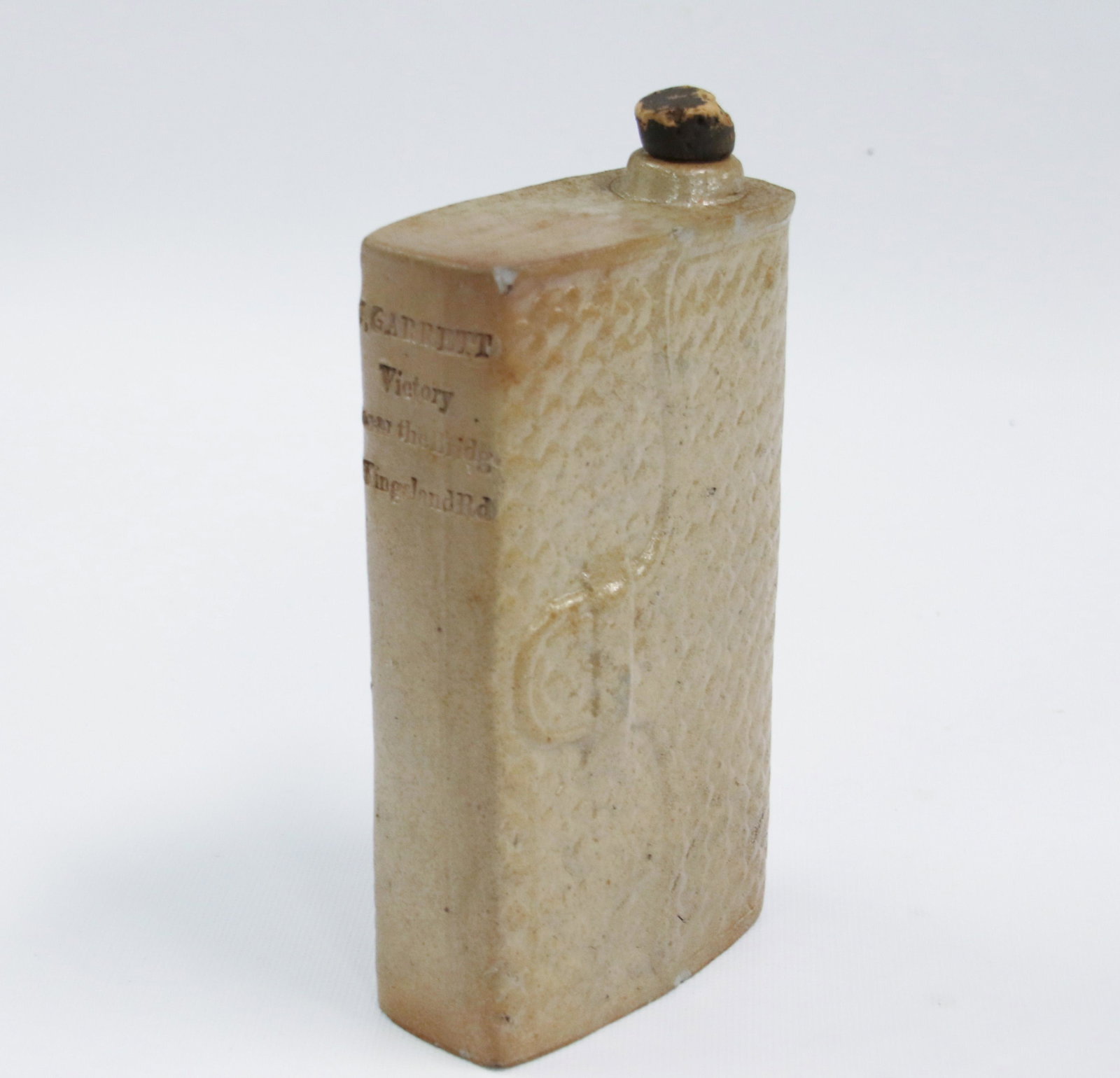 STONEWARE FLASK: STONEWARE FLASK MARKED "J. GARRETT" VICTORY NEAR THE BRIDGE - KINGSLAND RD Size: FLASK 5 3/4" H X 3 1/2" We do not give IN-HOUSE shipping quotes. Please email japakmail@earthlink.net - All items once 
