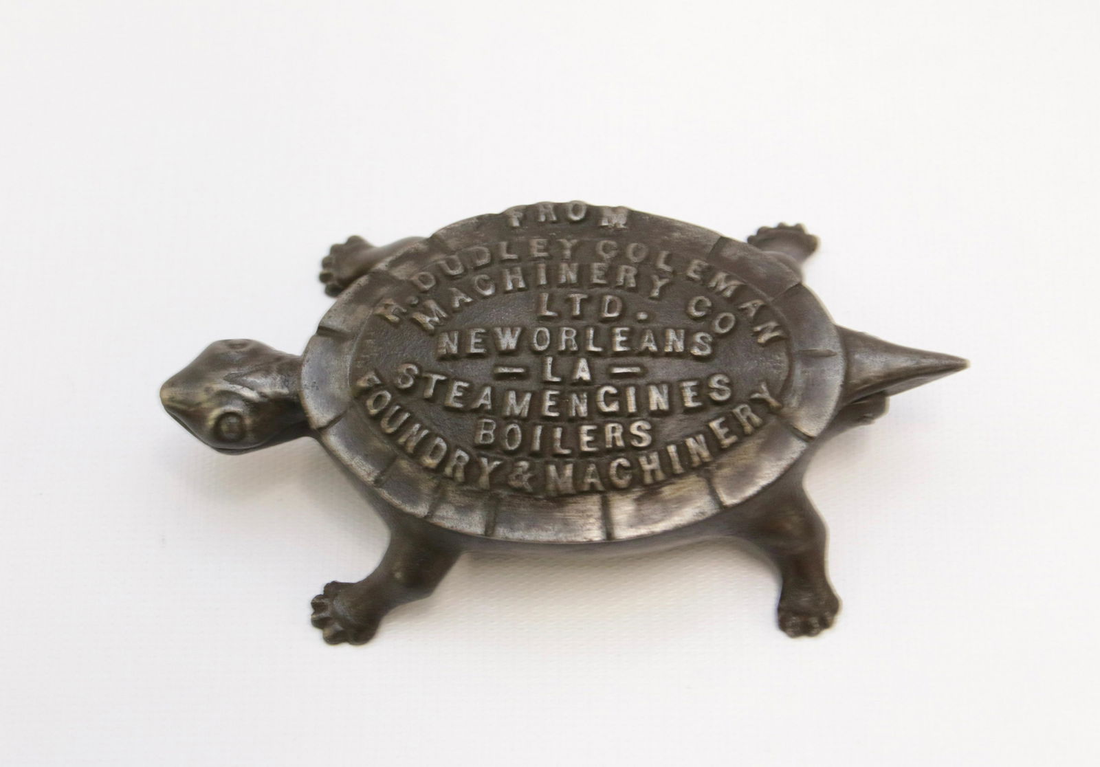 CAST IRON ADVERTISING TURTLE: H. DUDLEY COLEMAN MACHINERY COMPANY - NEW ORLEANS, LOUISIANA Size: 5 1/4" L We do not give IN-HOUSE shipping quotes. Please email japakmail@earthlink.net - All items once paid will be taken to our shi