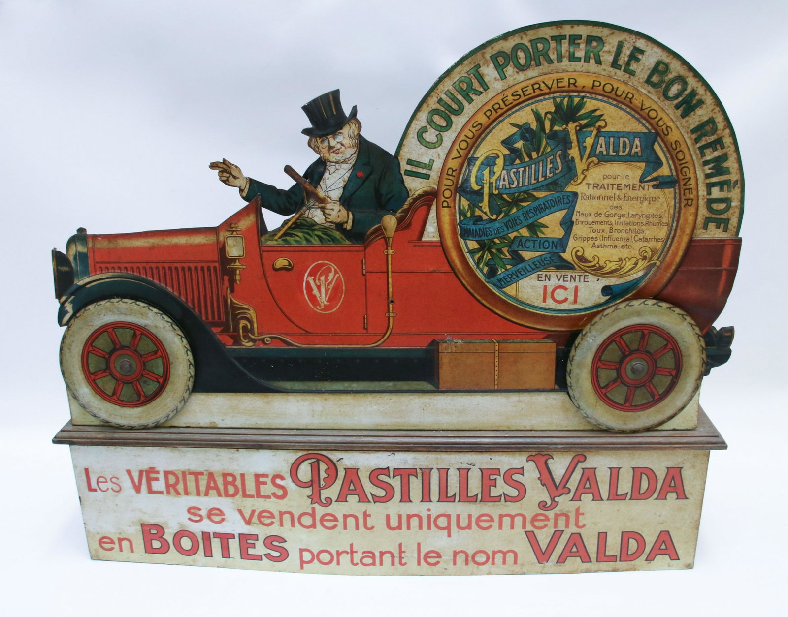 1930'S PHARMACY ADVERTISING AUTOMATON: IN THE FORM OF AN OPEN AIR CAR WITH GENTLEMAN AND TOP HAT DRIVING - ADVERTISING PASTILLES VALDA - LITHOGRAPH SHEET METAL - FRANCE, 1930 - WIND UP MECHANISM Size: 26" H X 32" W X 7" D We do not give IN