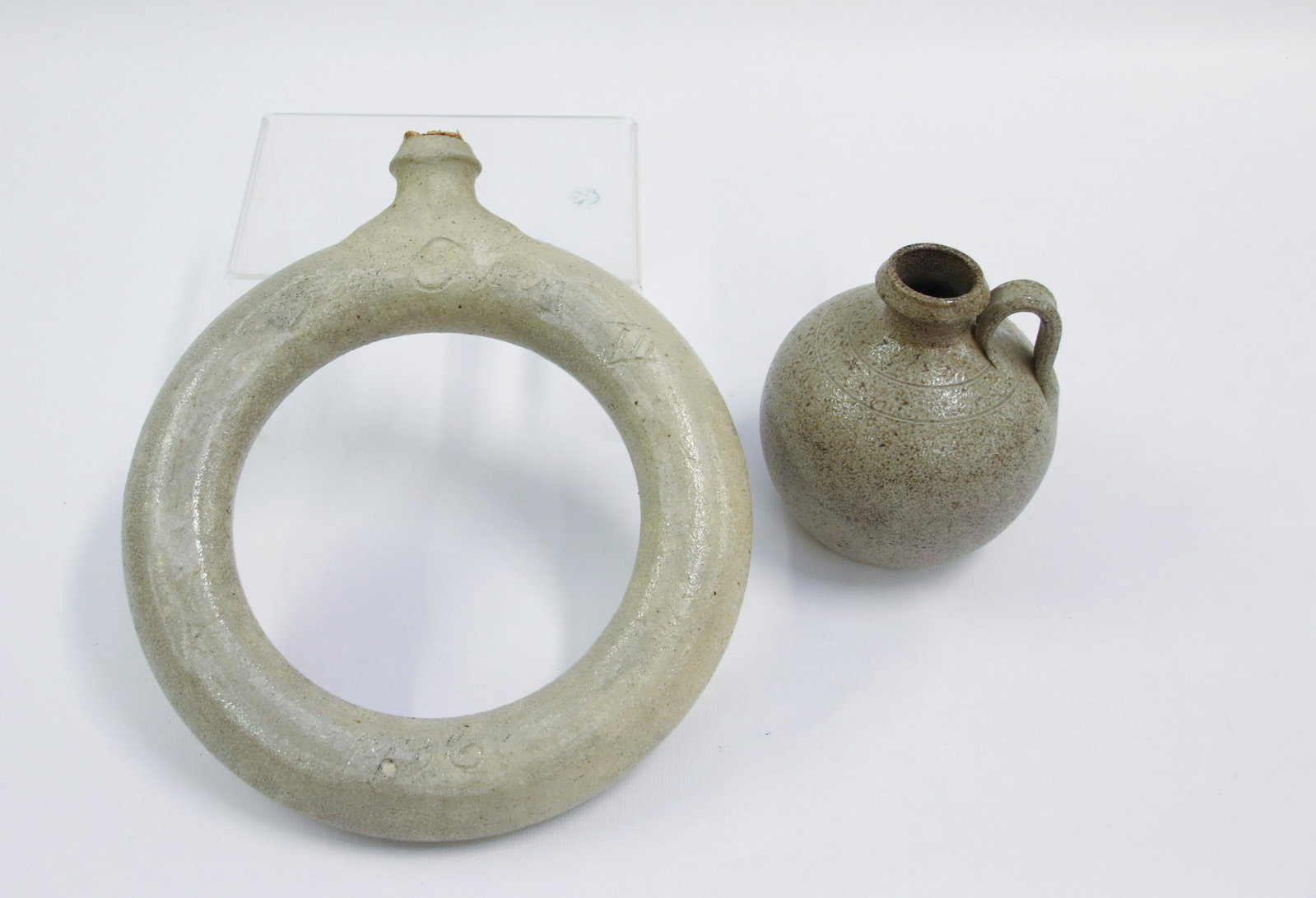PAIR OF BEN OWEN III POTTERY PIECES: - 1989 JUG AND HARVEST FLASK 1986 Size: 4 3/4" H - FLASK 8 1/2" DIAMETER We do not give IN-HOUSE shipping quotes. Please email japakmail@earthlink.net - All items once paid will be taken to our shippe