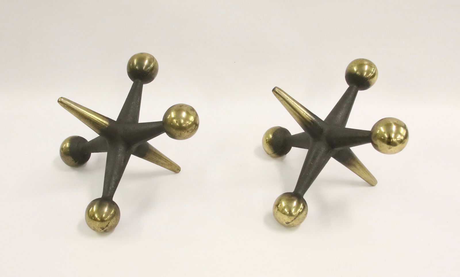 MODERN SET OF JACKS: BOOKEND JACKS BY: BILL CURRY - PAIR OF DECORATIVE METAL WITH BRASS COLORED ENDS Size: 6 1/2" X 8 1/2" We do not give IN-HOUSE shipping quotes. Please email japakmail@earthlink.net - All items once pai