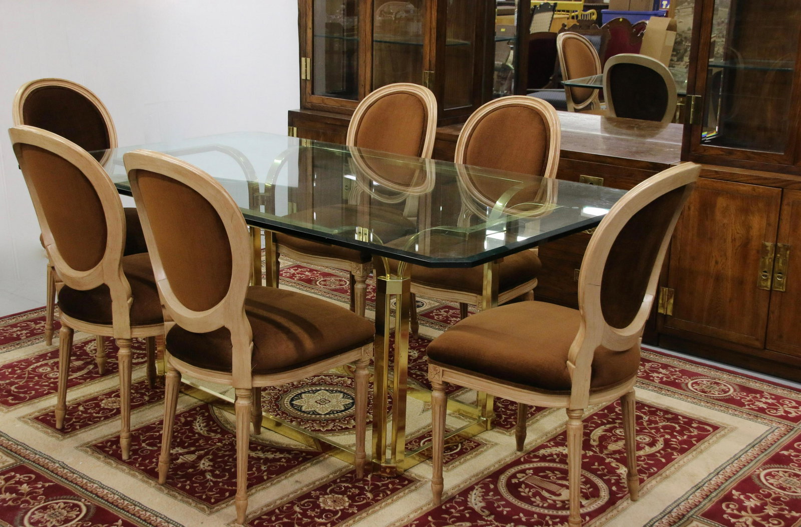VINTAGE GLASS TOP TABLE AND CHAIRS: RECTANGULAR BEVELED GLASS TABLE WITH BRASS BASE. SIX WEIMAN FRENCH STYLE UPHOLSTERED CHAIRS Size: 29 1/2" H X 72" X 42" CHAIRS 38" X 20" X 18" We do not give IN-HOUSE shipping quotes. Please email jap