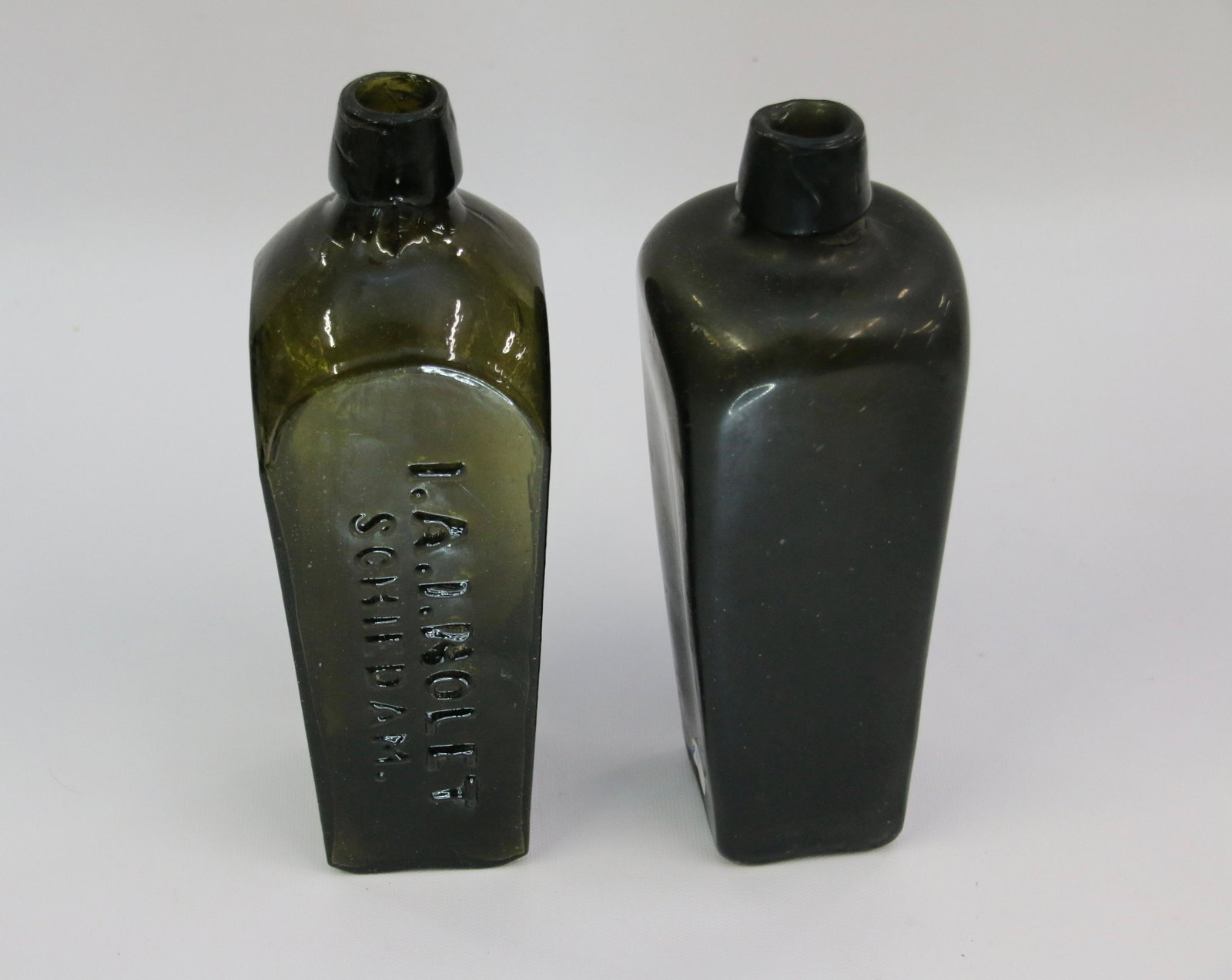 (2) CASES OF GIN BOTTLES: A. NOLET SCHIEDAMA LIGHT OLIVE GREEN - BLACK GLASS CASE BOTTLE Size: 9" X 3" - 8.5" X 3" Important Shipping Information: We do not give IN-HOUSE shipping quotes. Please email japakmail@earthlink.net -