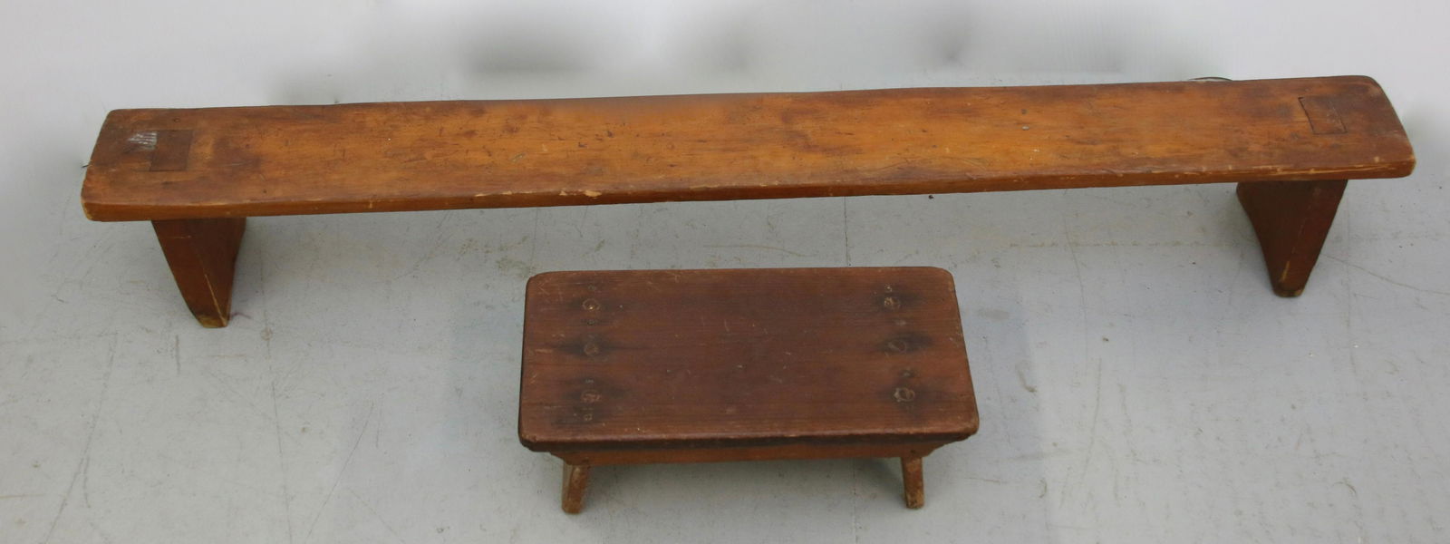PAIR OF WOODEN BENCHES: INCLUDES: FOOTSTOOL WITH BOOTJACK LEGS AND MORTISED KNEELING BENCH Size: 6" H X 16" X 7" AND 8" H X 51 1/2" X 6" Important Shipping Information: We do not give IN-HOUSE shipping quotes. Please email