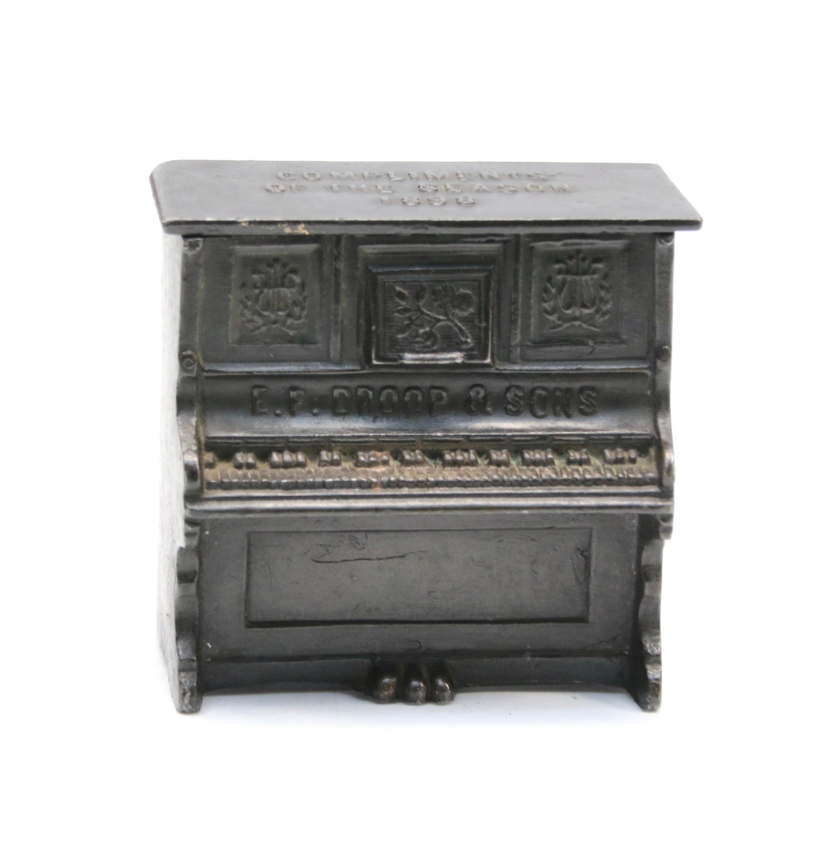19TH CENTURY ADVERTISING MATCH HOLDER: IN THE FORM OF A PIANO - COMPLIMENTS OF THE SEASON 1898, REGENT MFG. CO. ADVERTISING NOVELTIES, CHICAGO - WITH LIFT LID - E.F. DROOP & SONS - CAST METAL Dimensions: 3" H X 3" W X 1 1/2" D