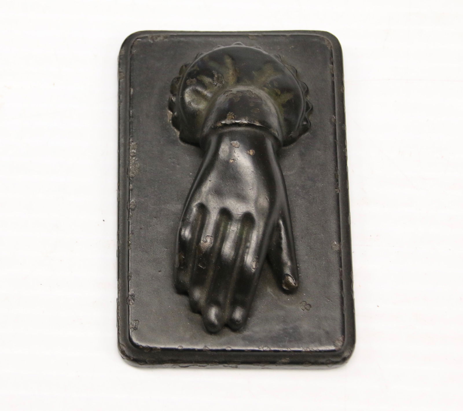 CAST IRON PAPER WEIGHT: IN THE FORM OF A HAND - PAINTED BLACK Dimensions: 3 3/4" X 2 1/2"