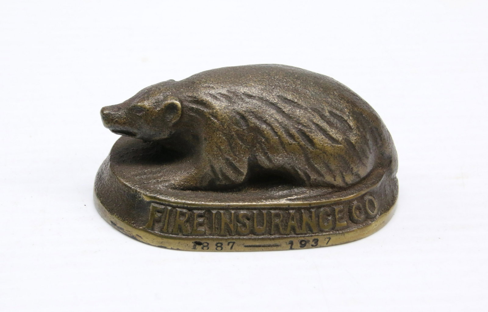 ADVERTISING PAPER WEIGHT: THE BADGER MUTUAL" 1887-1937 - CAST METAL PAINTED GOLD Dimensions: 4