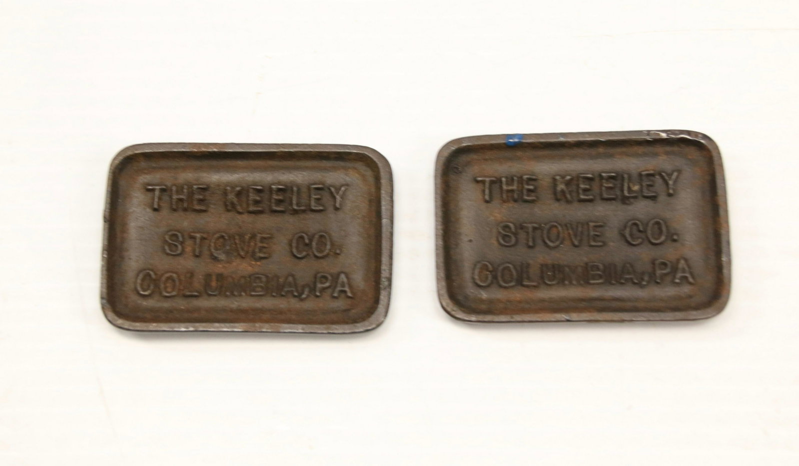 PR. OF STOVE ADVERTISING PAPERWEIGHTS: THE KEELEY STOVE CO. - COLUMBIA, PA - (2) TILE SHAPED Dimensions: 2 3/4" X 2"