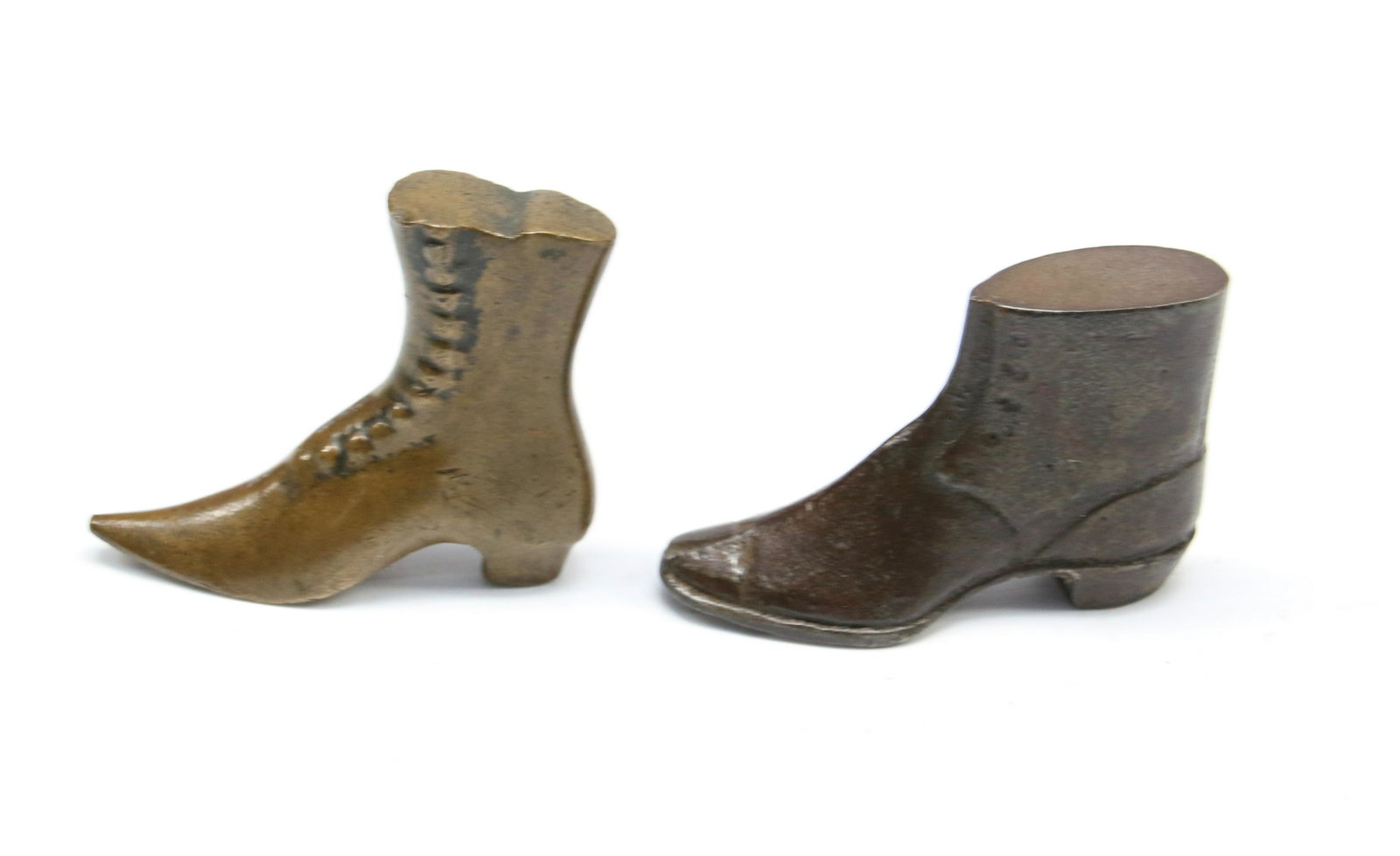PR. OF CAST IRON BOOT PAPERWEIGHTS: MAN'S BOOT AND WOMEN'S HIGH BUTTON BOOT Dimensions: 1 3/4" AND 2"