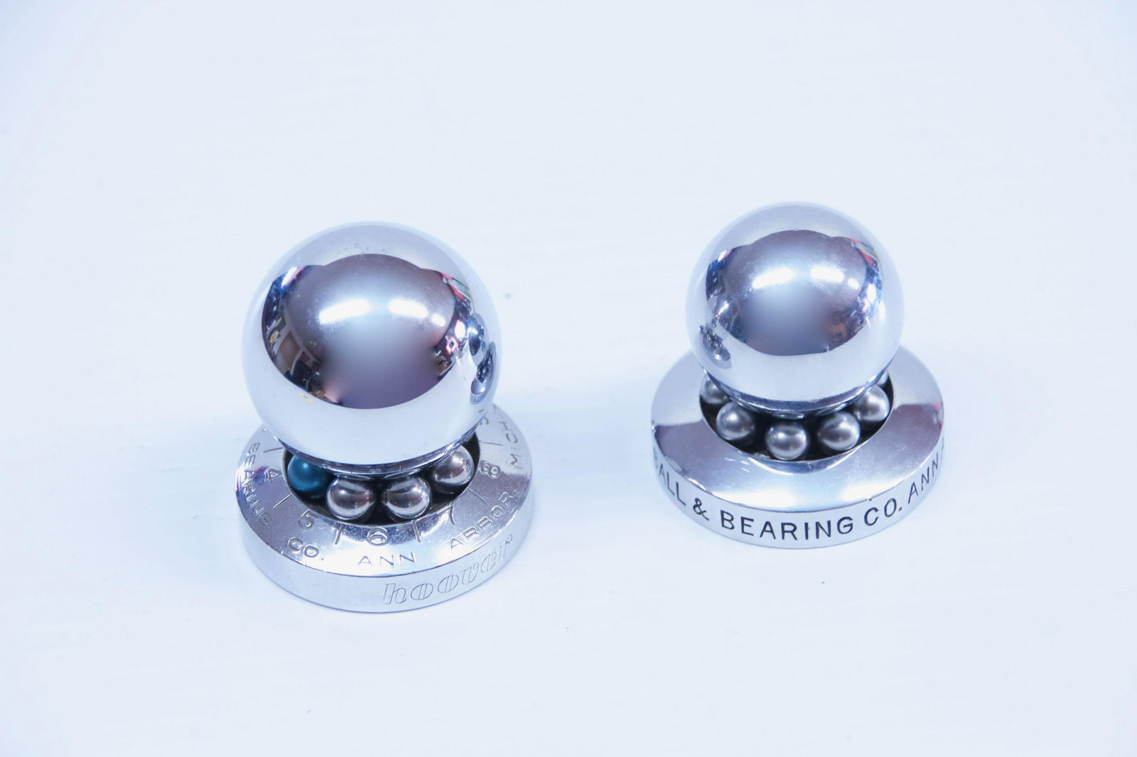 PAIR OF ADVERTISING PAPERWEIGHTS: 1920S HOOVER BALL & BEARING CO. Dimensions: 1 3/4" TO 2" H